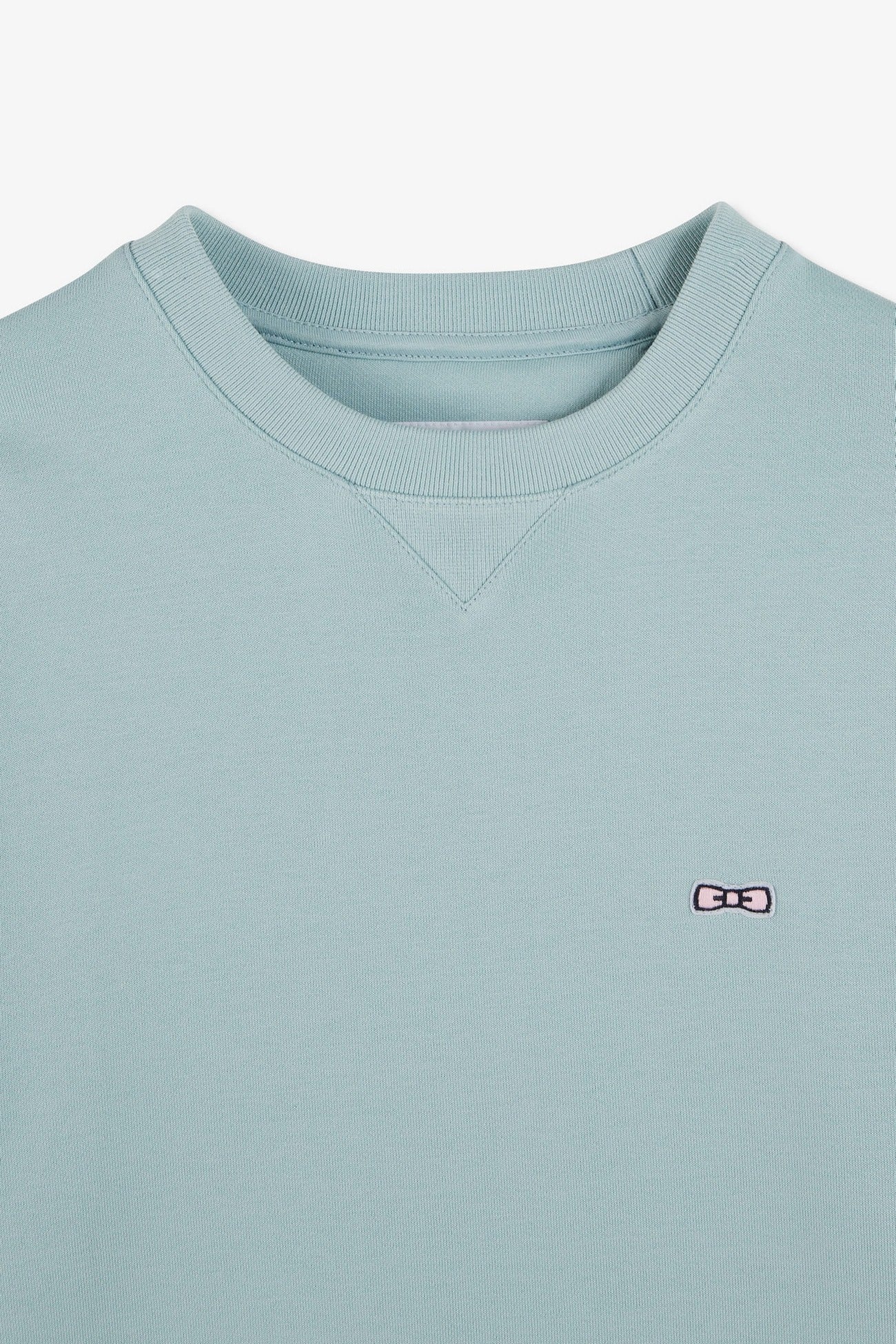 Green fleece round-neck sweatshirt with bow tie embroidery