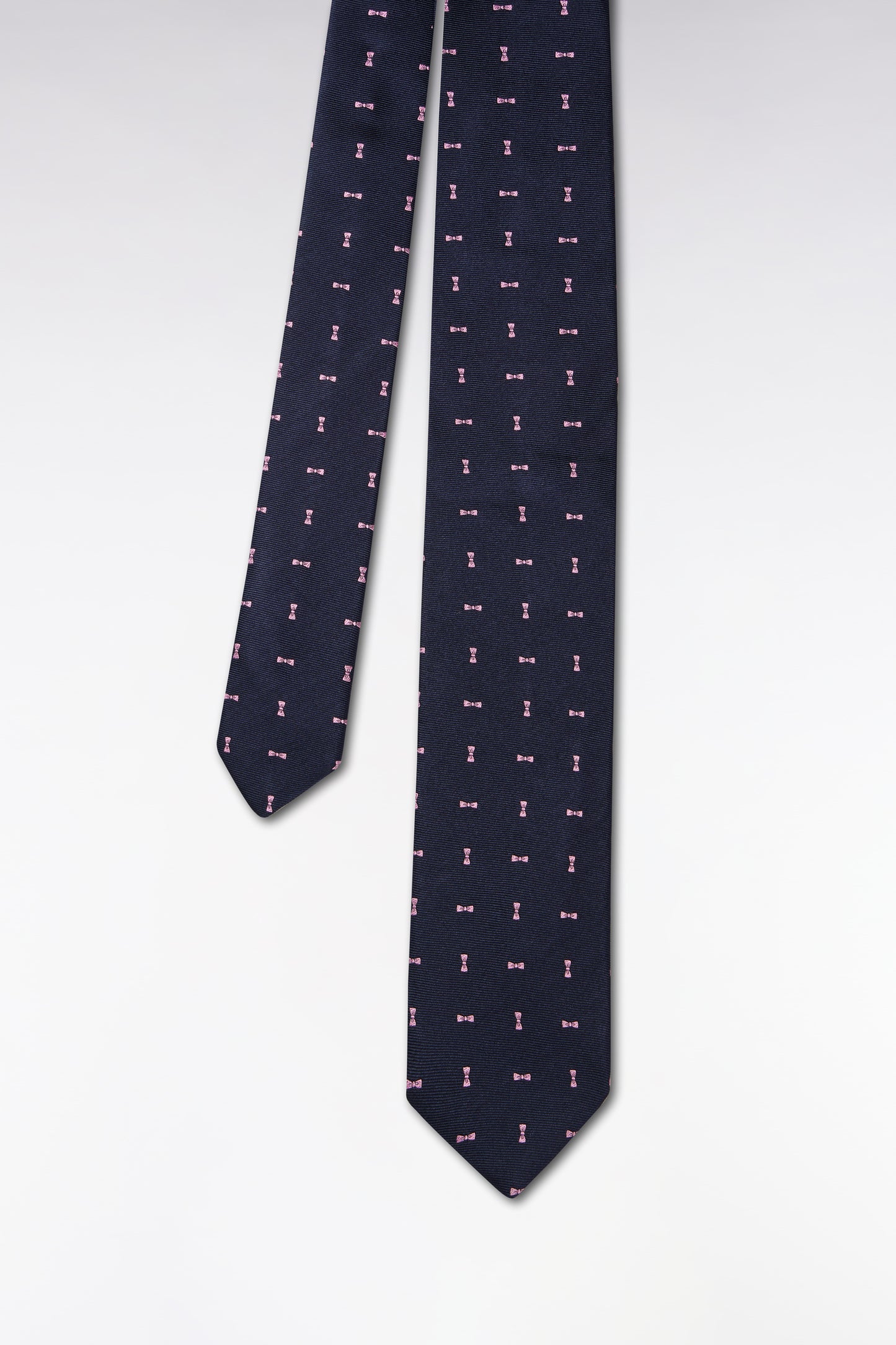Navy silk tie with pink bow tie pattern