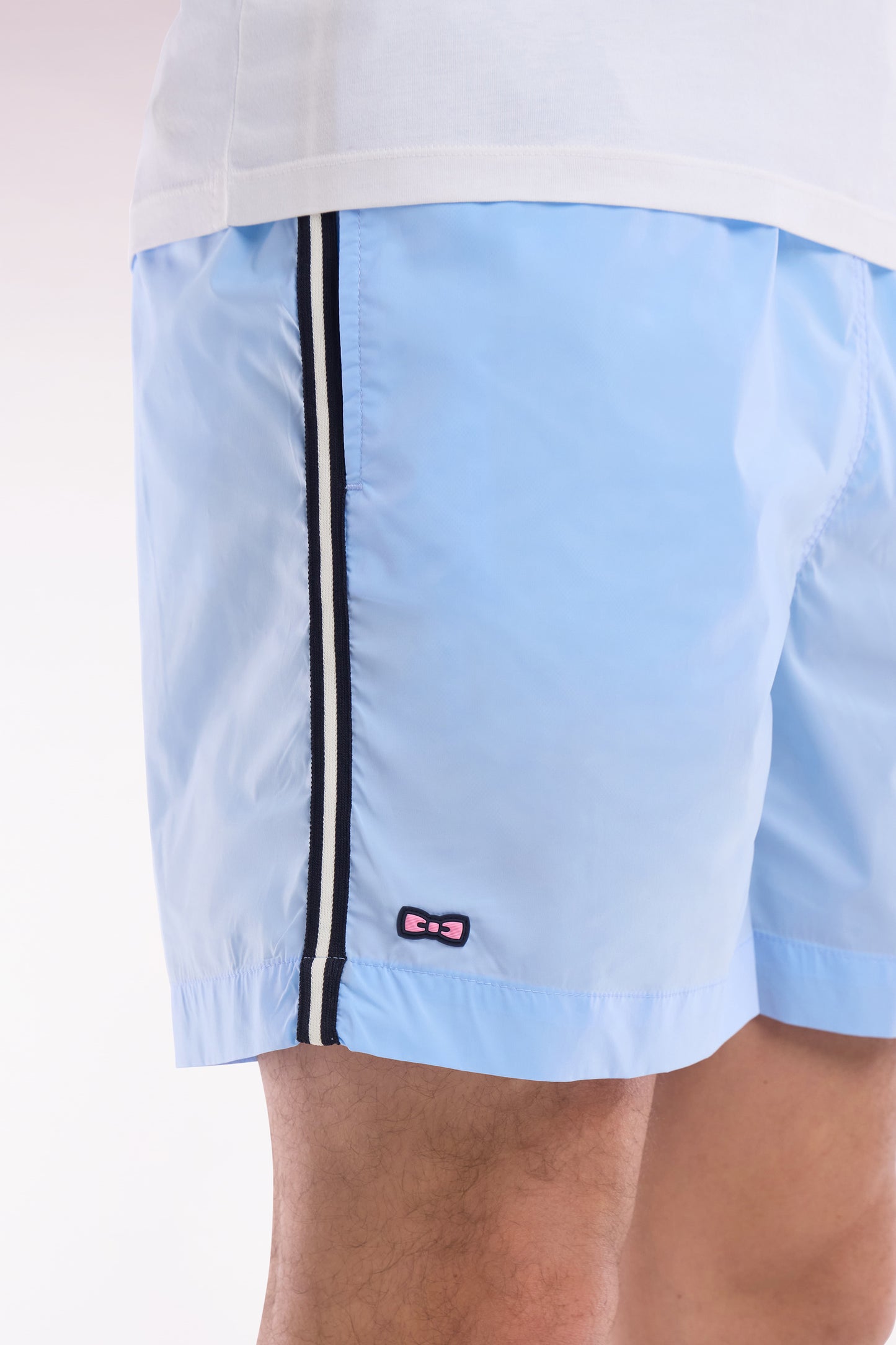 Sky blue swimsuit with tricolor details