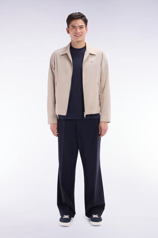 Wide-leg pleated trousers in navy stretch wool blend