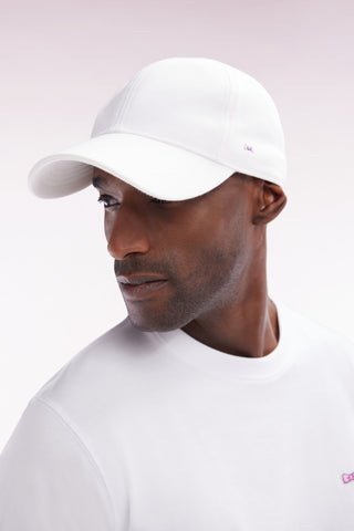 White cotton piqué cap with bow tie embroidery