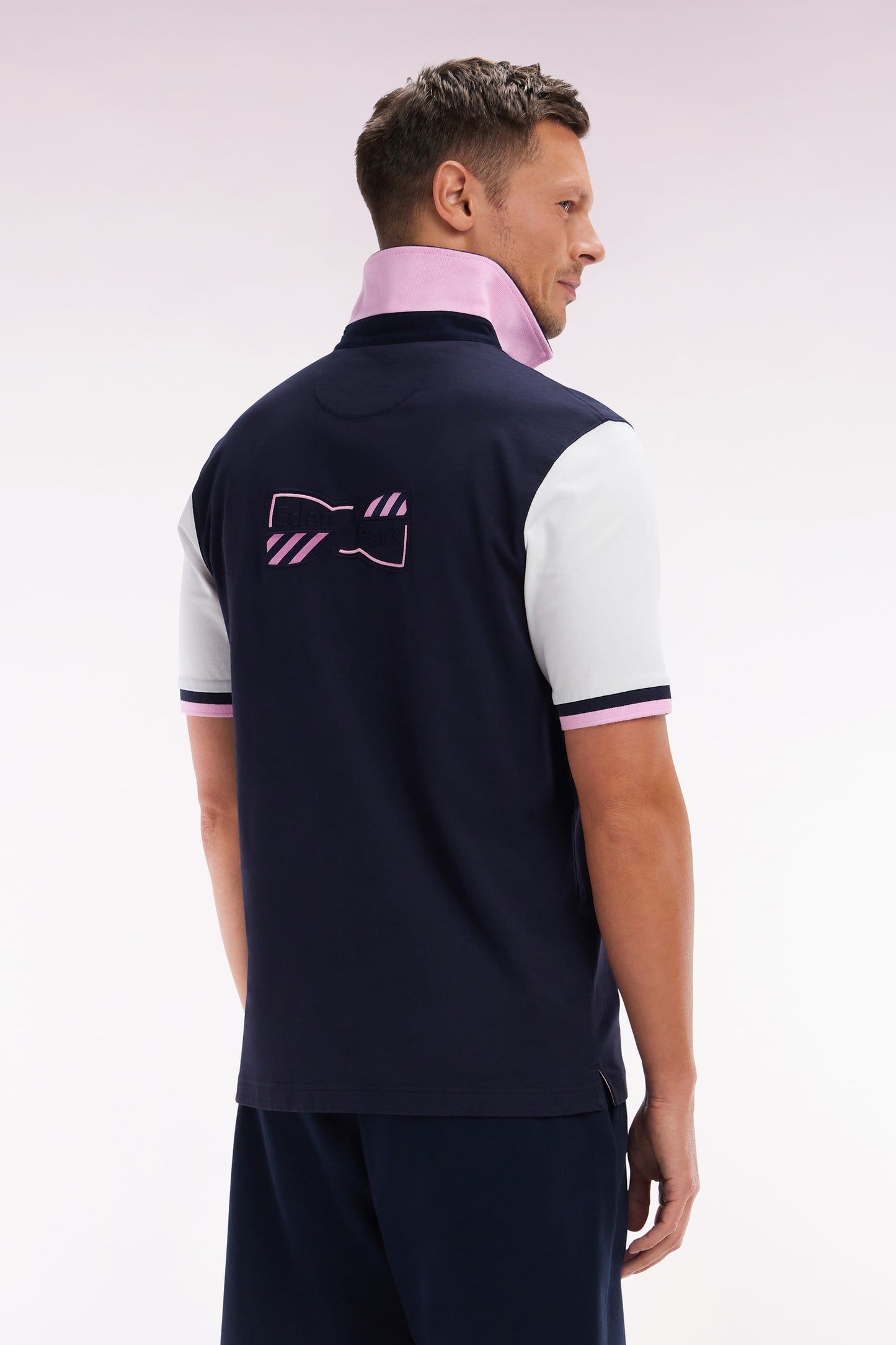 Straight-cut short-sleeved rugby shirt in white cotton jersey with bow tie embroidery