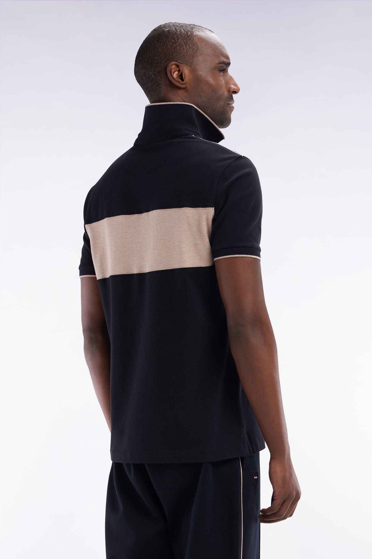 Slim-fit short-sleeved polo shirt in black stretch cotton with contrasted stripe