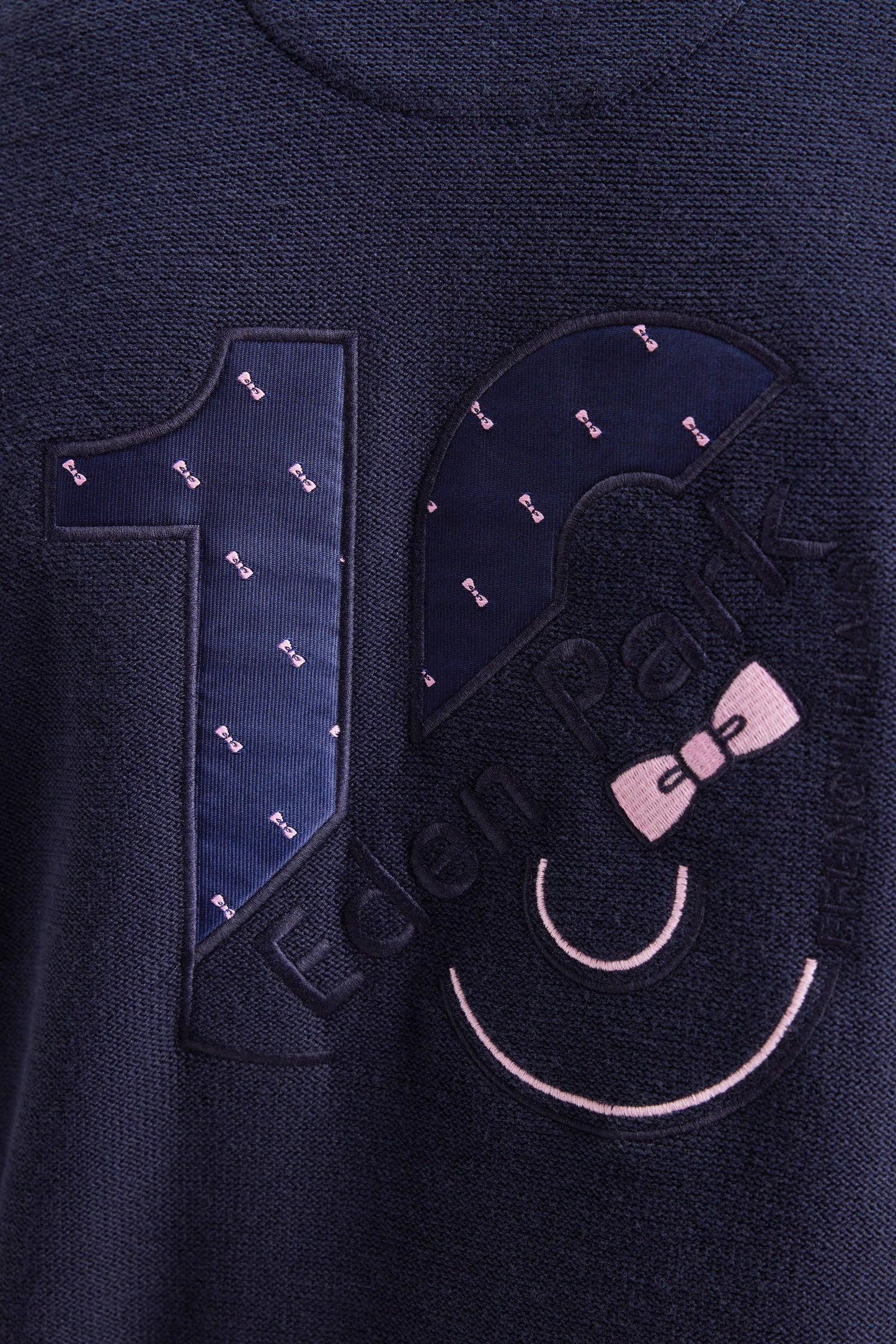 Navy cotton zipped cardigan with stripes of pink sleeves, straight cut