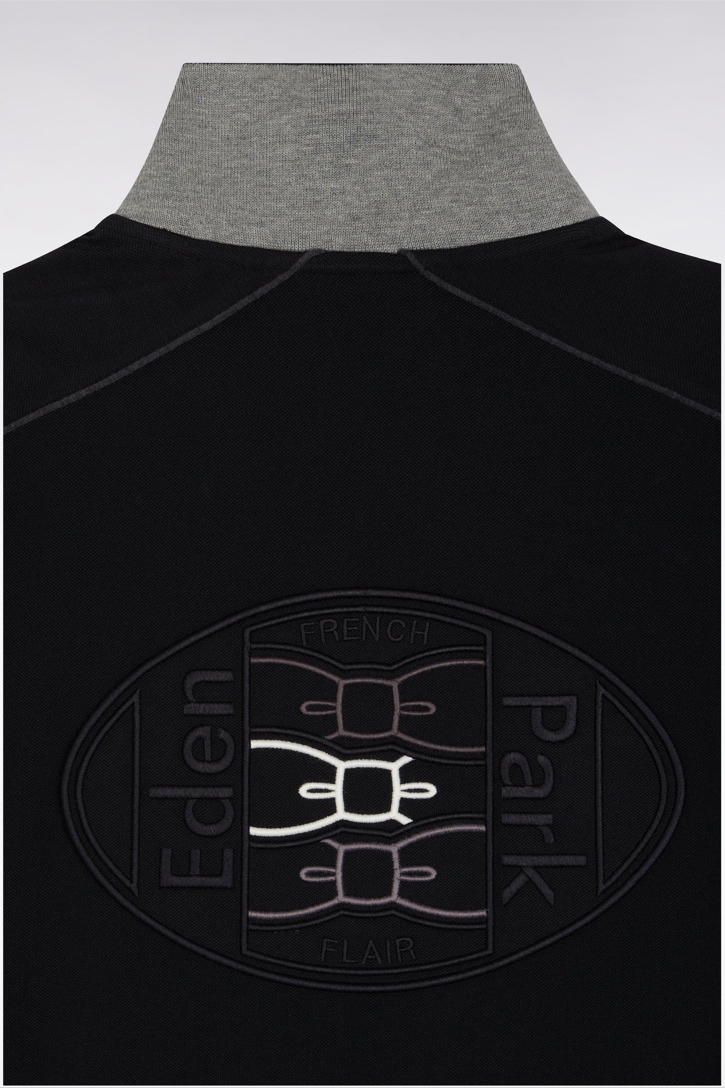 Short-sleeved polo shirt in black cotton piqué with colored piping