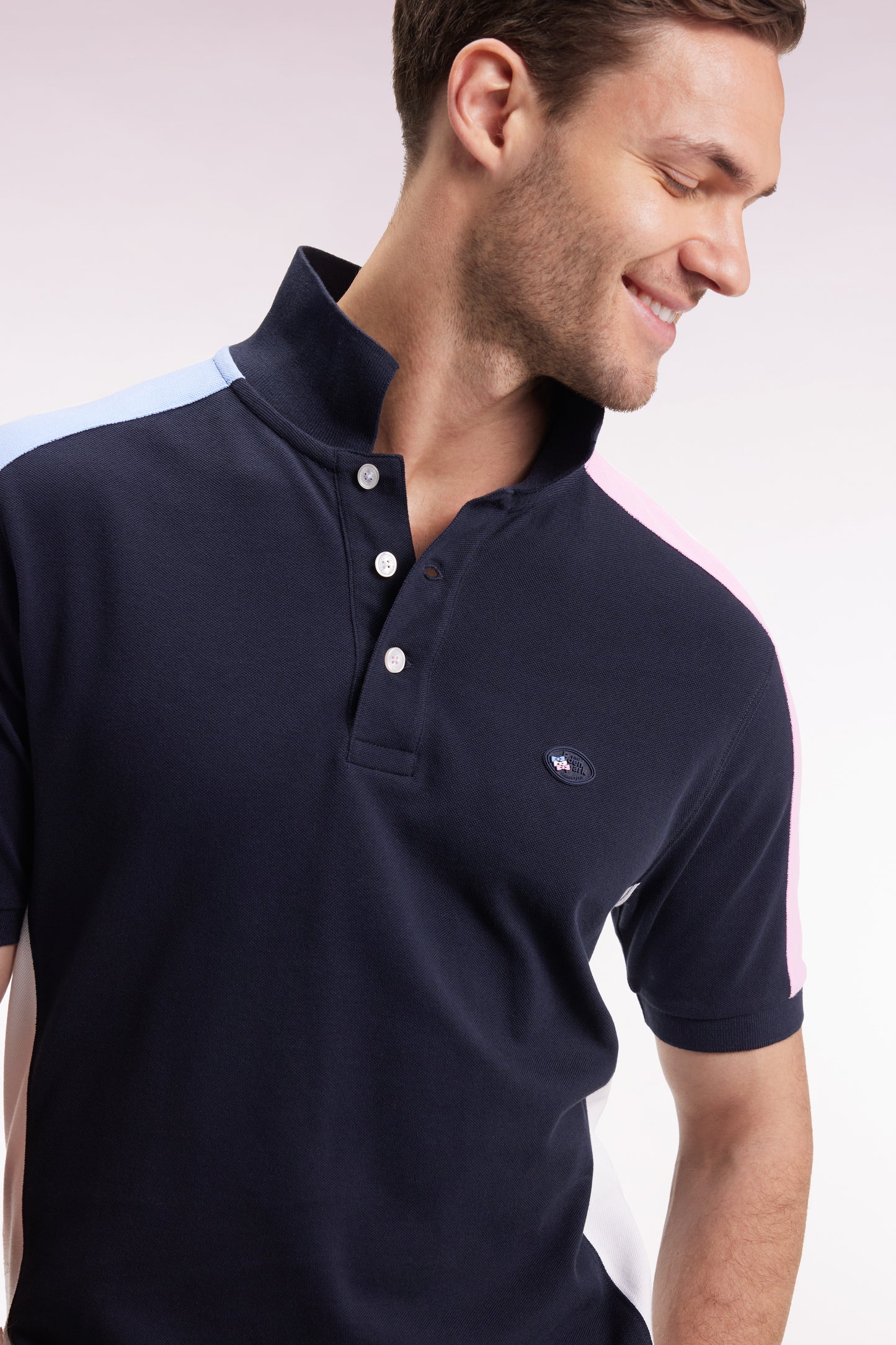 Short-sleeved polo shirt in navy cotton piqué with tricolored cut-outs