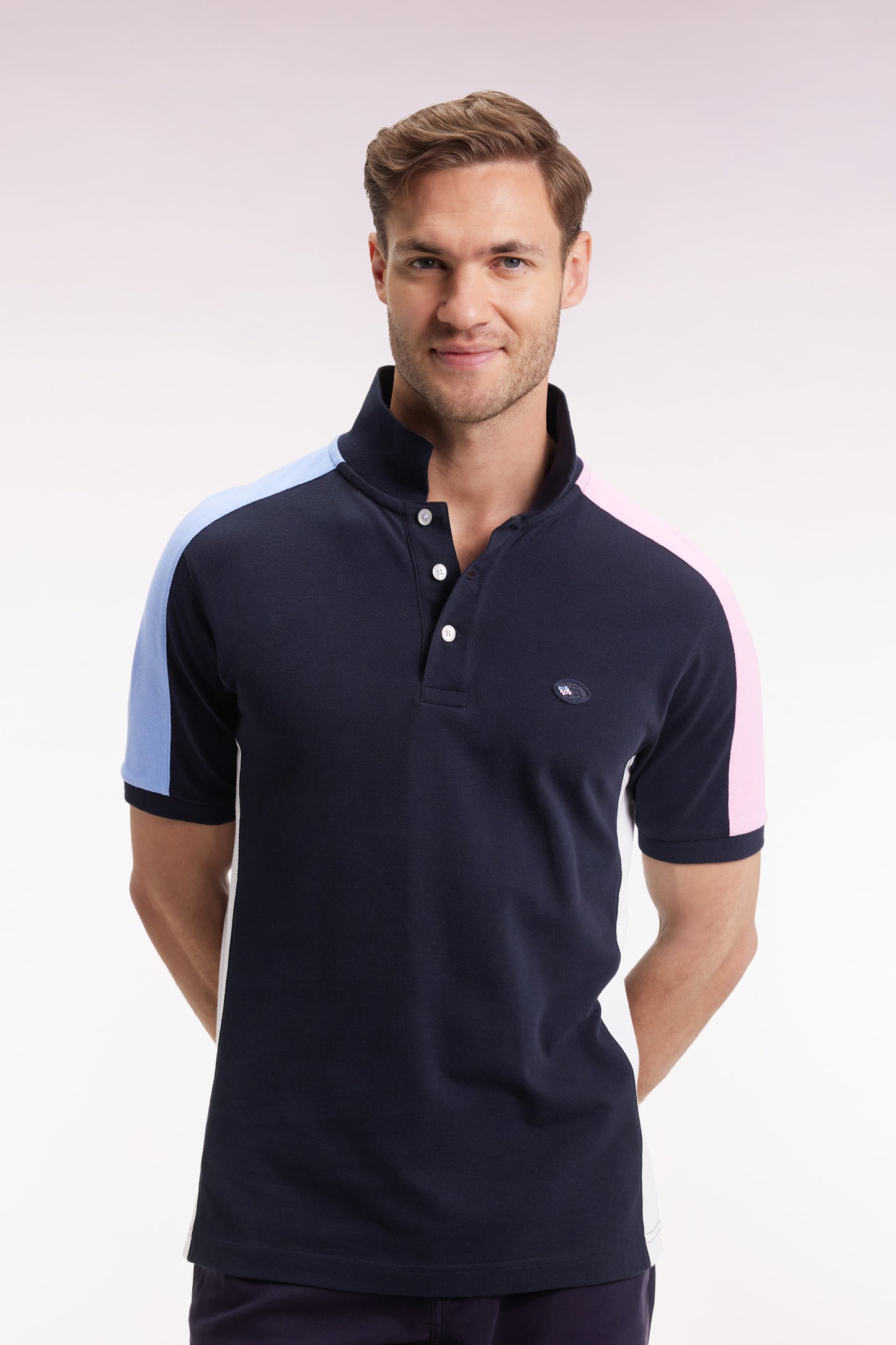Short-sleeved polo shirt in navy cotton piqué with tricolored cut-outs