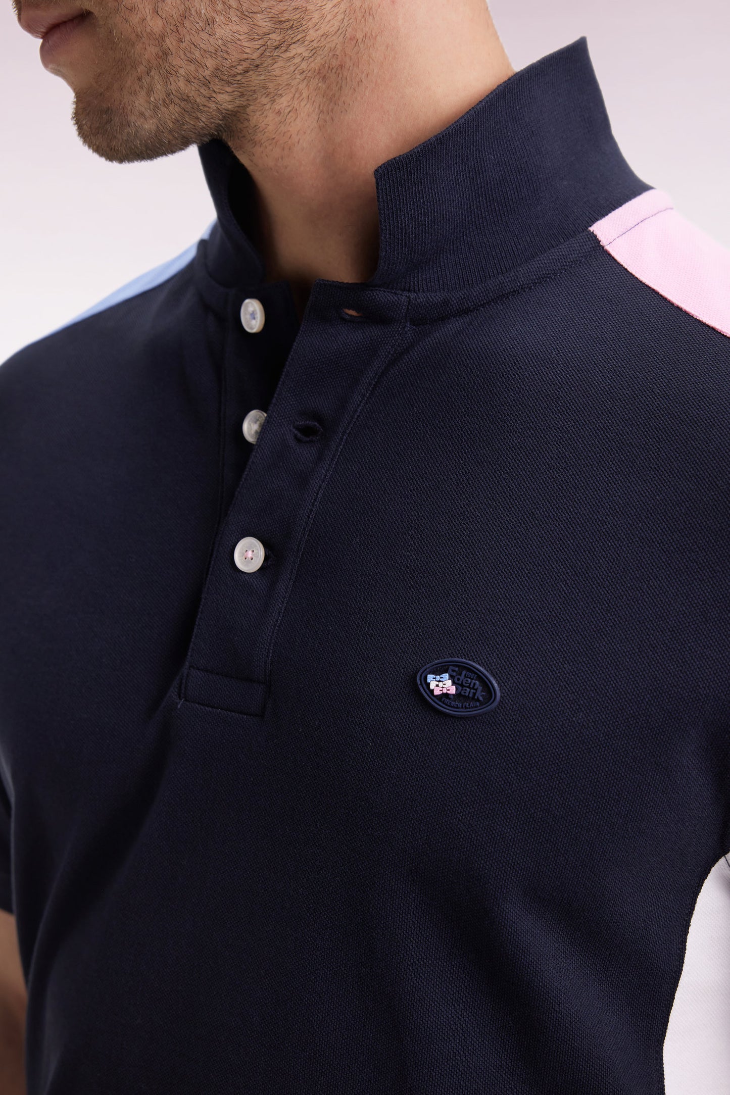 Short-sleeved polo shirt in navy cotton piqué with tricolored cut-outs