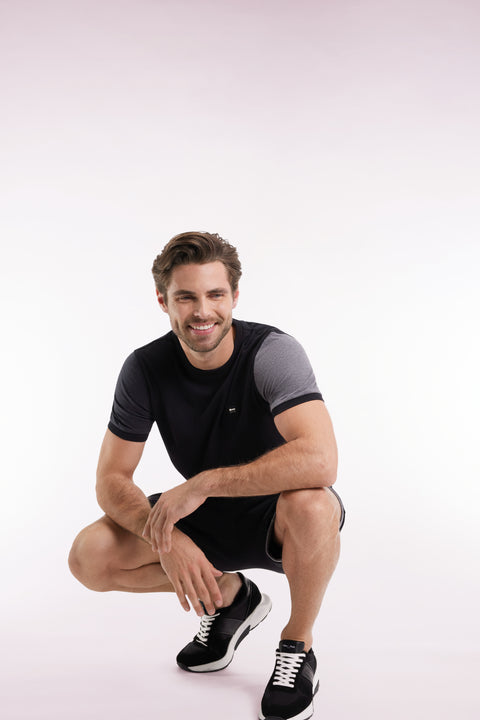 Black cotton T-shirt with contrasting short sleeves - Image 1