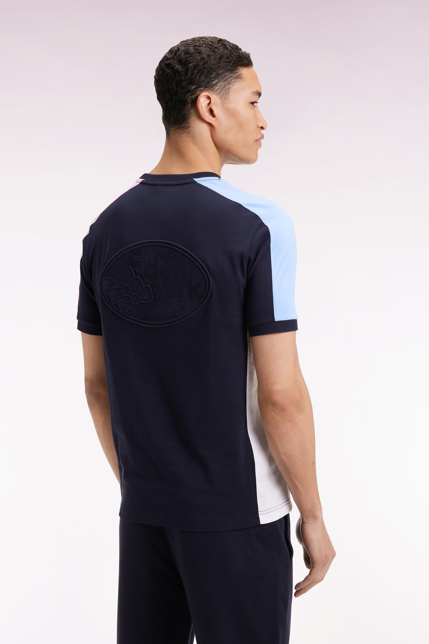 Short-sleeved navy cotton T-shirt with colorful cut-outs