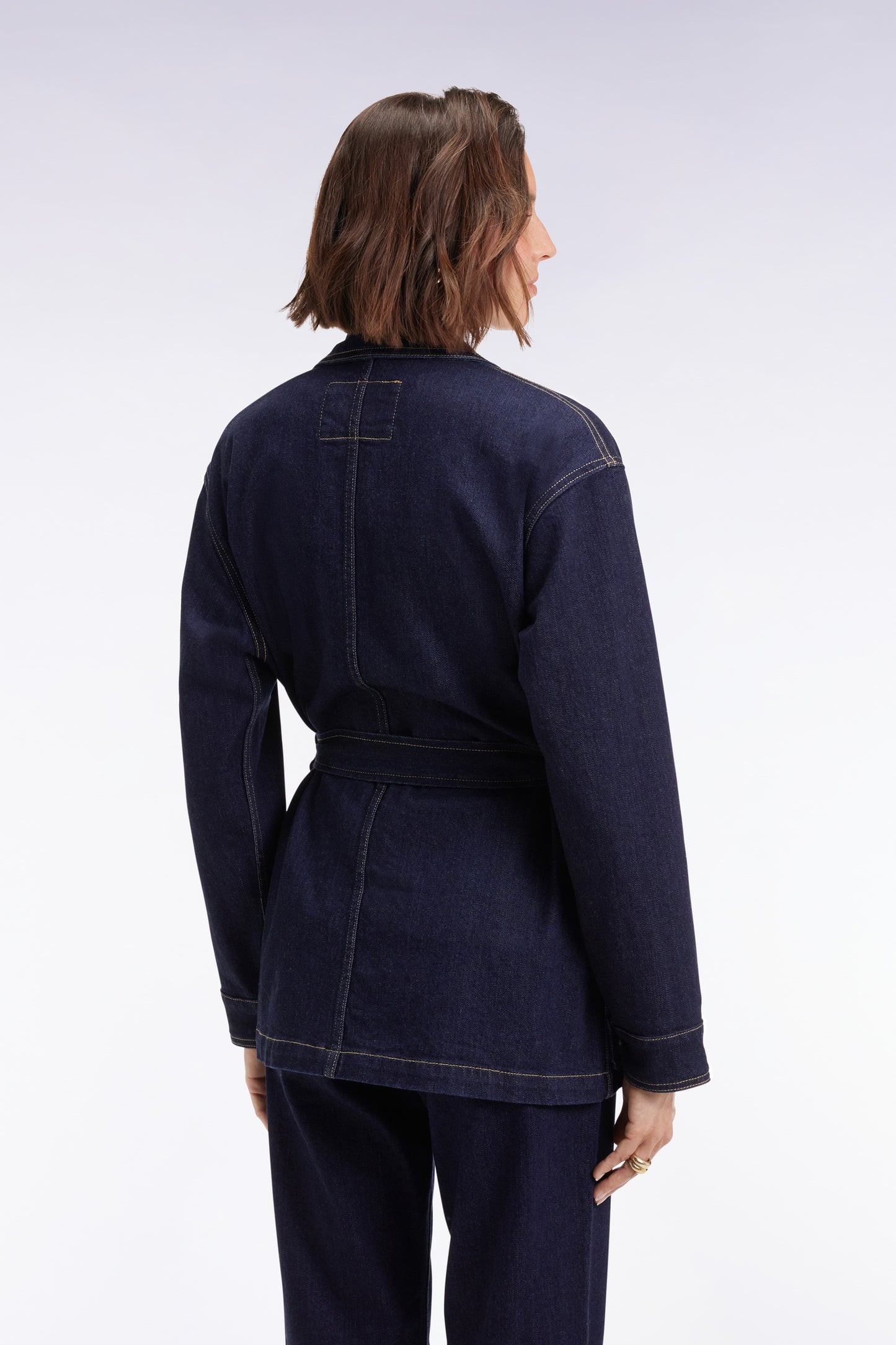 Belted overshirt in raw stretch denim Oversized cut