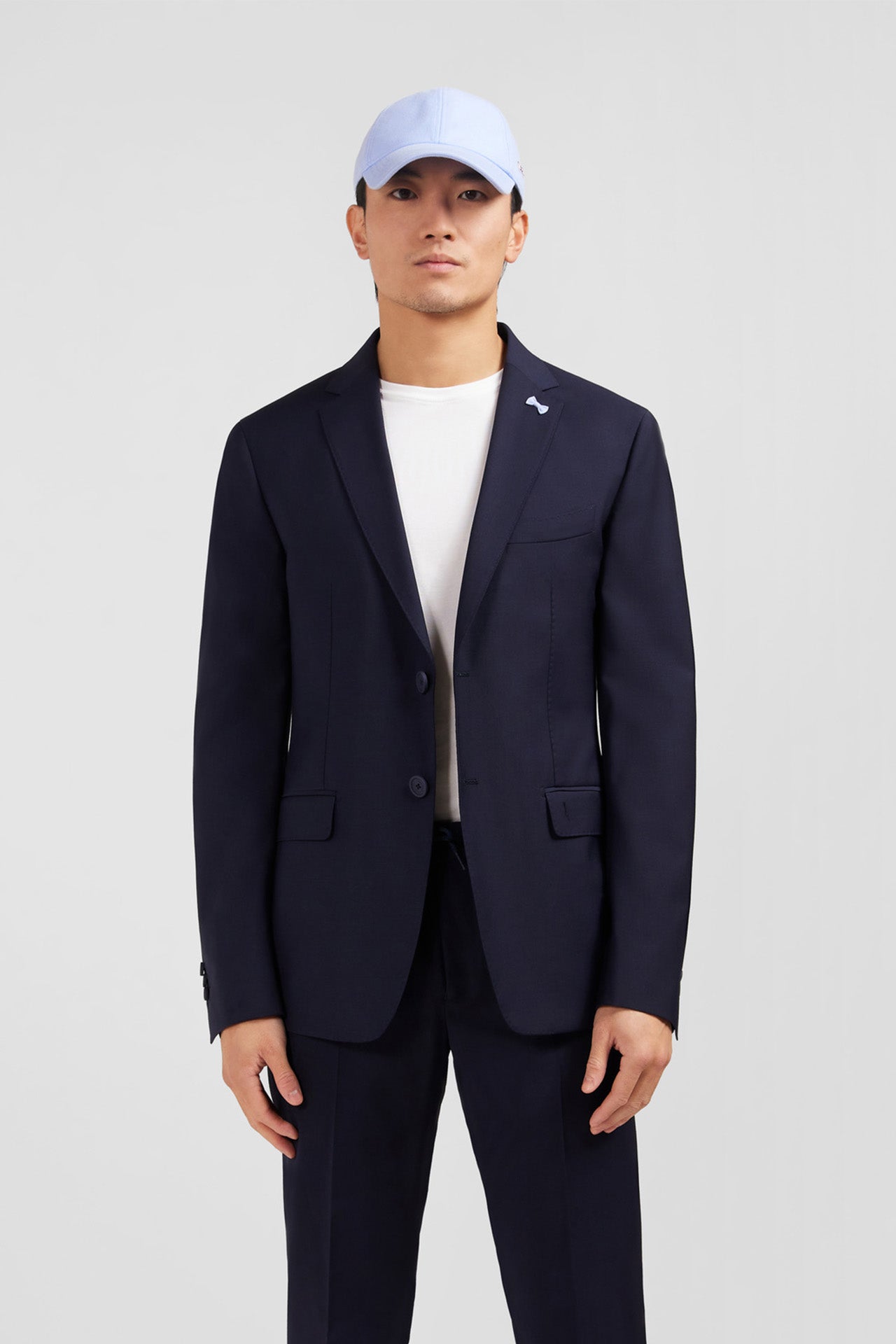 Dark blue blazer with embossed bow detail