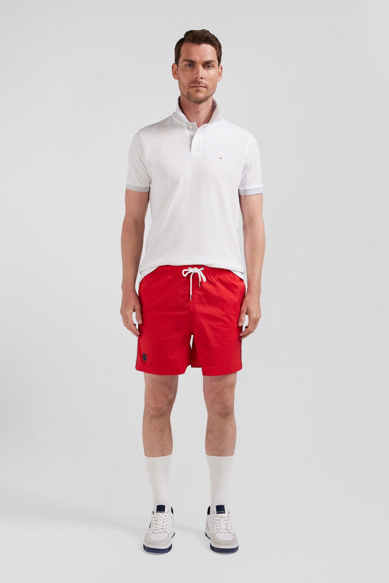 Swim shorts with tricoloured stripes