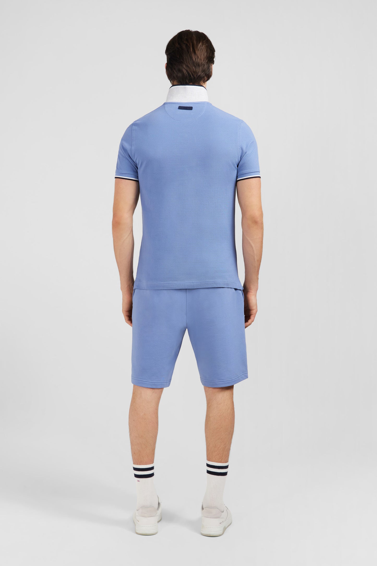 Plain light blue short-sleeved polo shirt