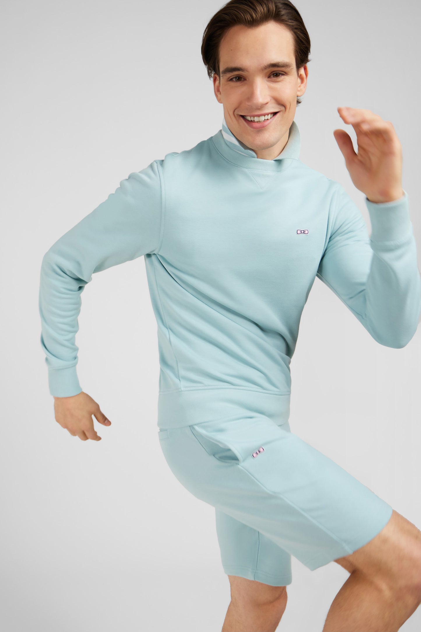 Green fleece round-neck sweatshirt with bow tie embroidery