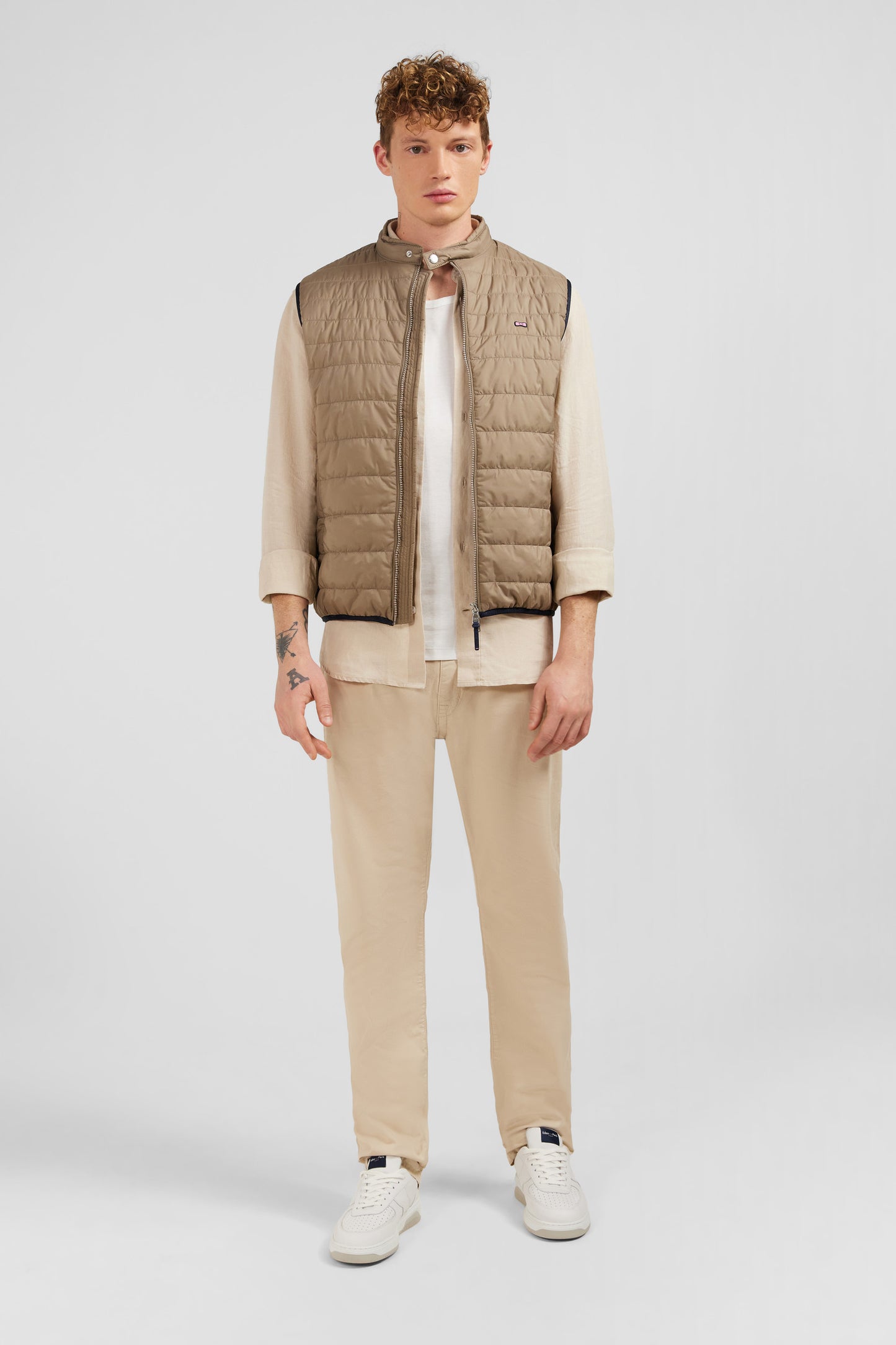 Beige sleeveless puffa jacket
