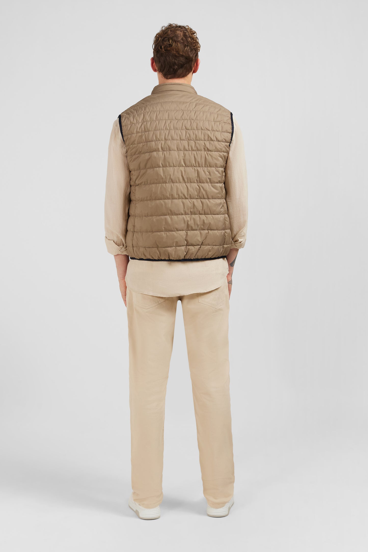 Beige sleeveless puffa jacket