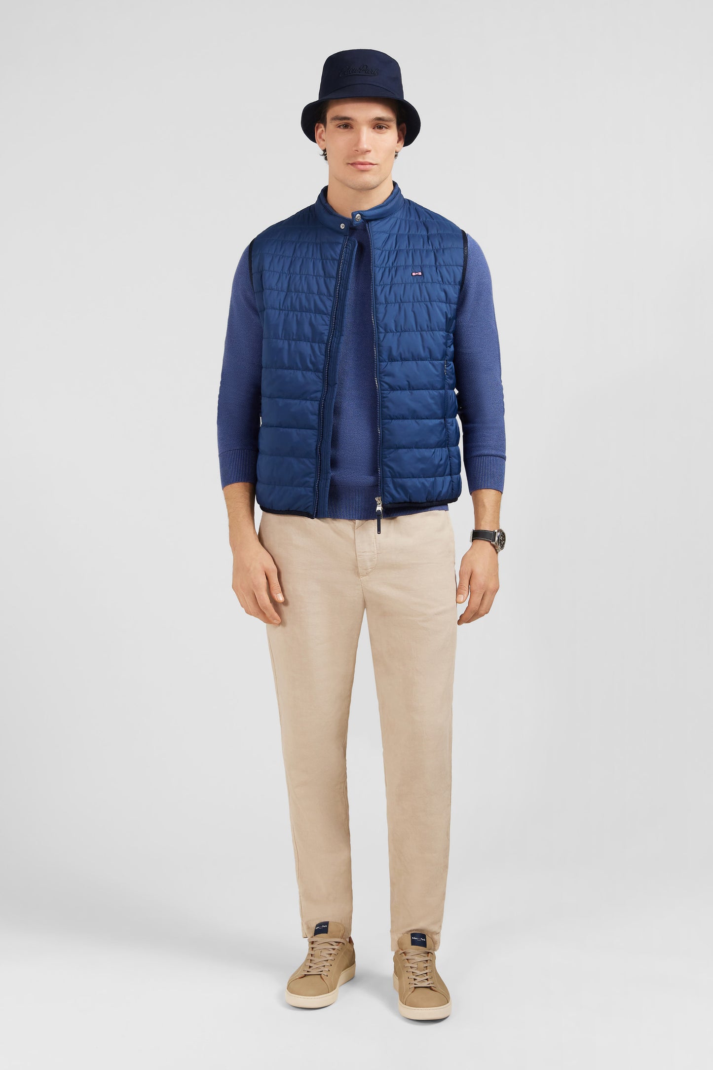 Blue sleeveless puffa jacket