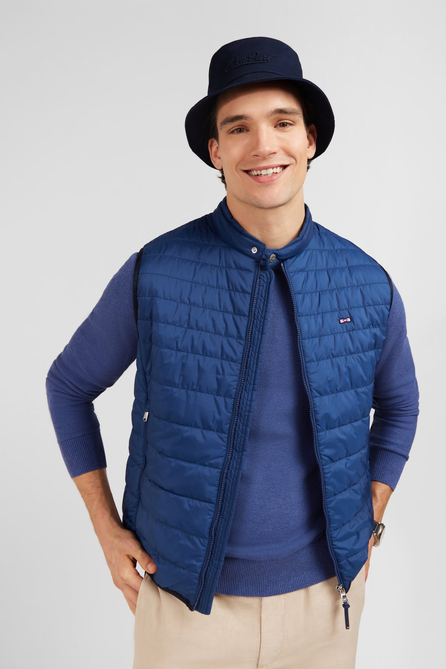 Blue sleeveless puffa jacket