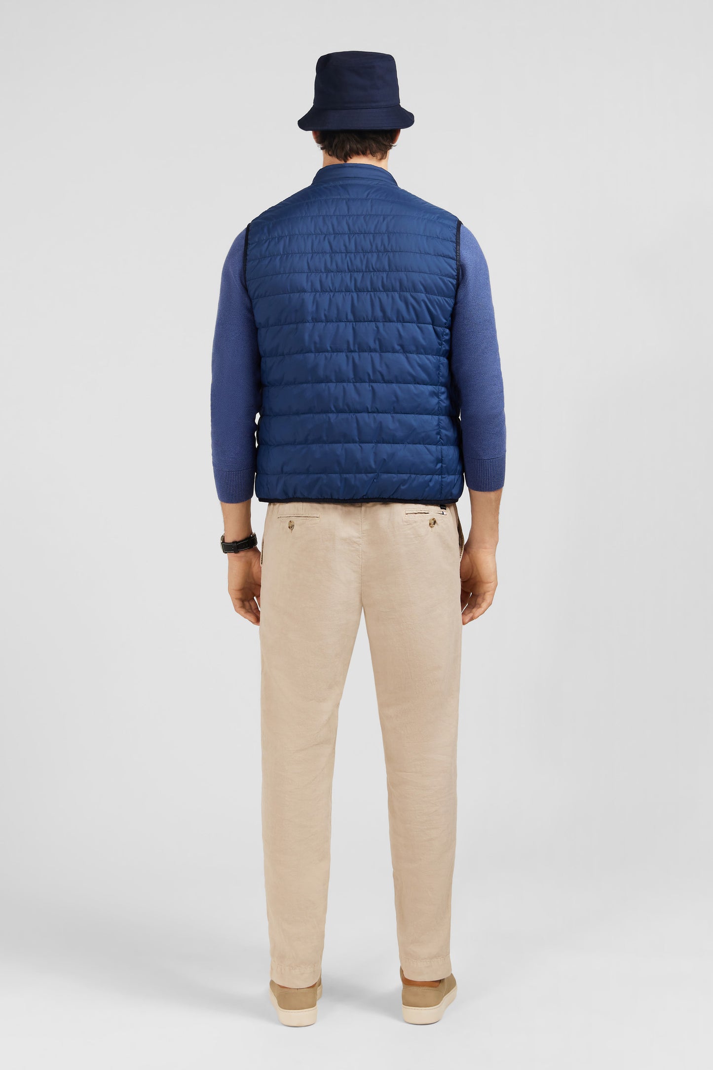 Blue sleeveless puffa jacket