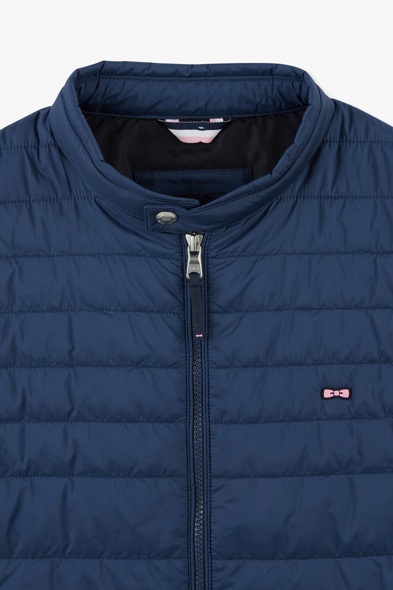 Blue sleeveless puffa jacket