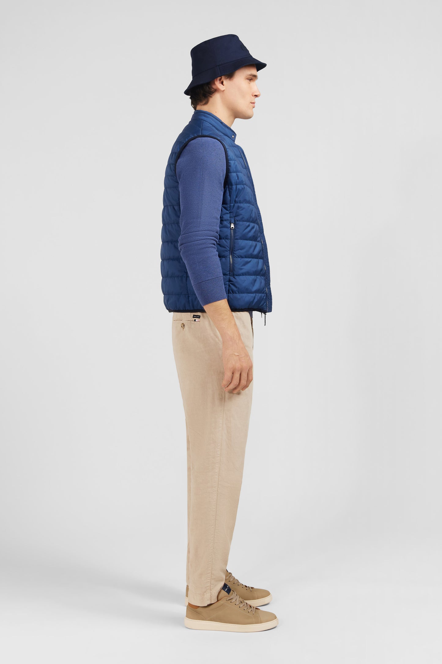 Blue sleeveless puffa jacket
