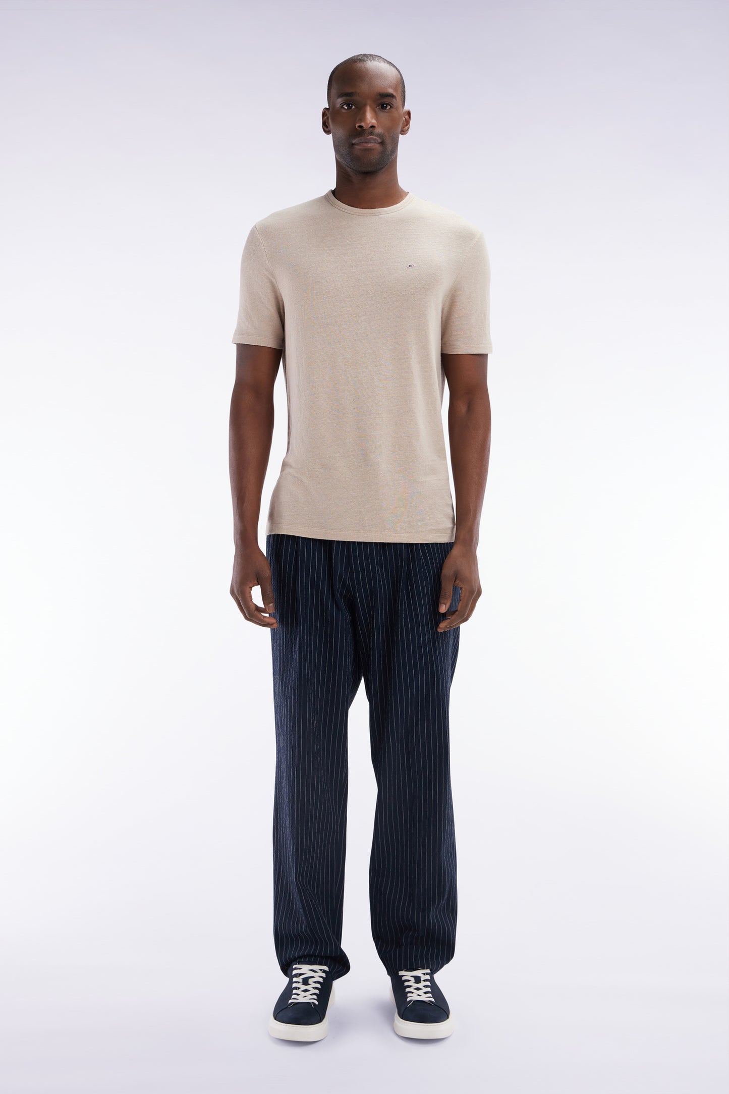 Navy stretch cotton seersucker trousers with tennis stripe