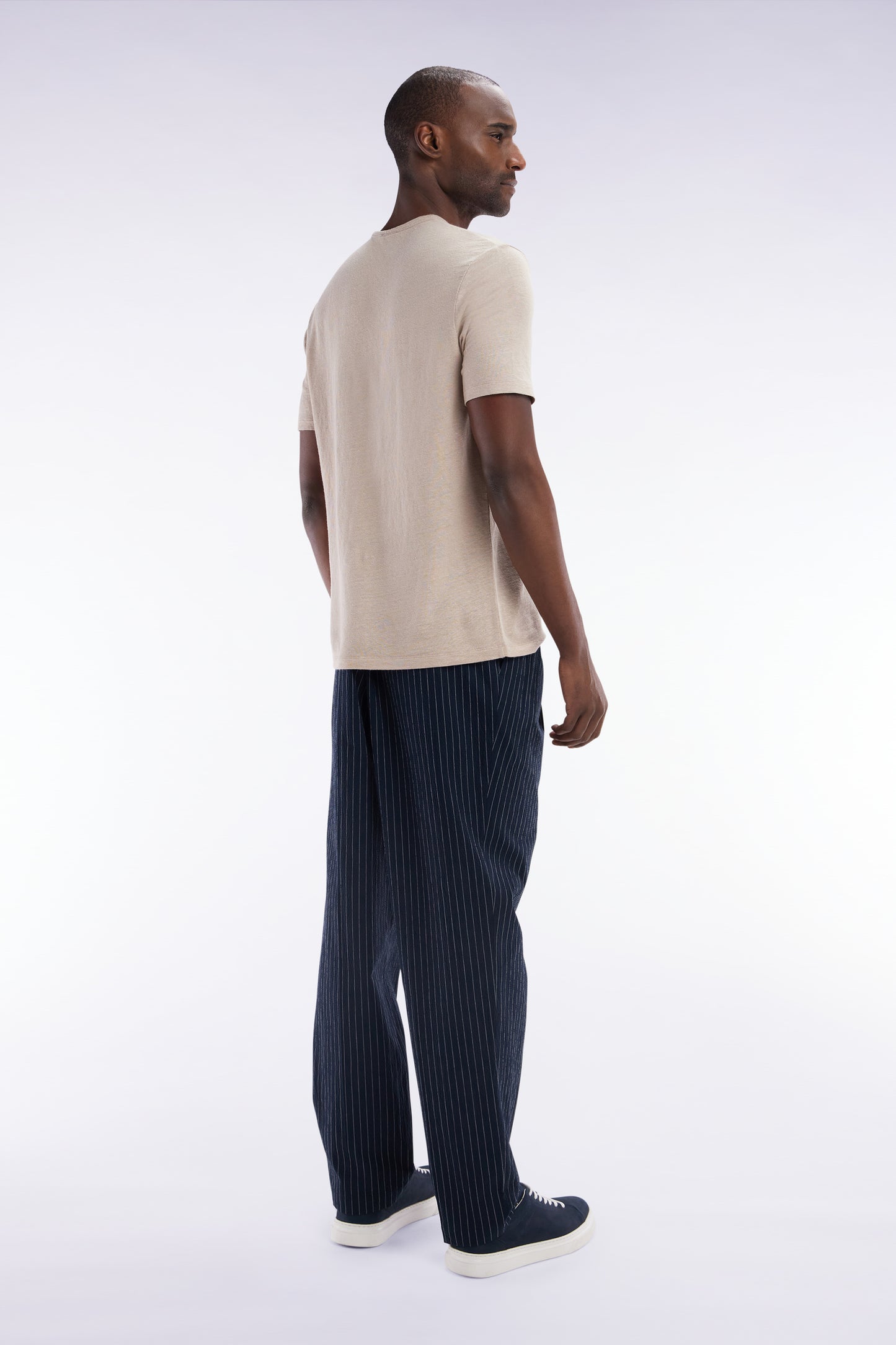 Navy stretch cotton seersucker trousers with tennis stripe