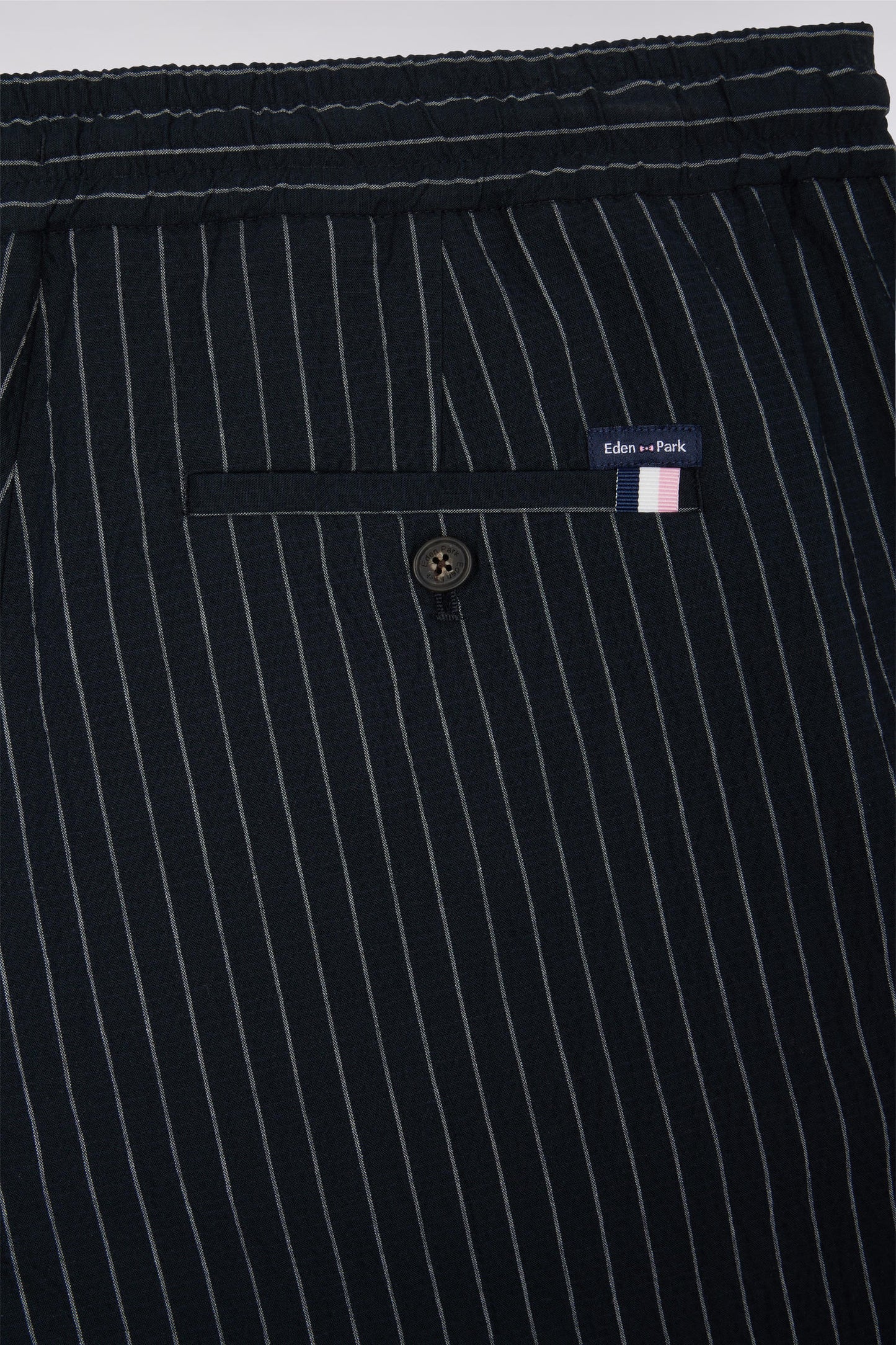 Navy stretch cotton seersucker trousers with tennis stripe