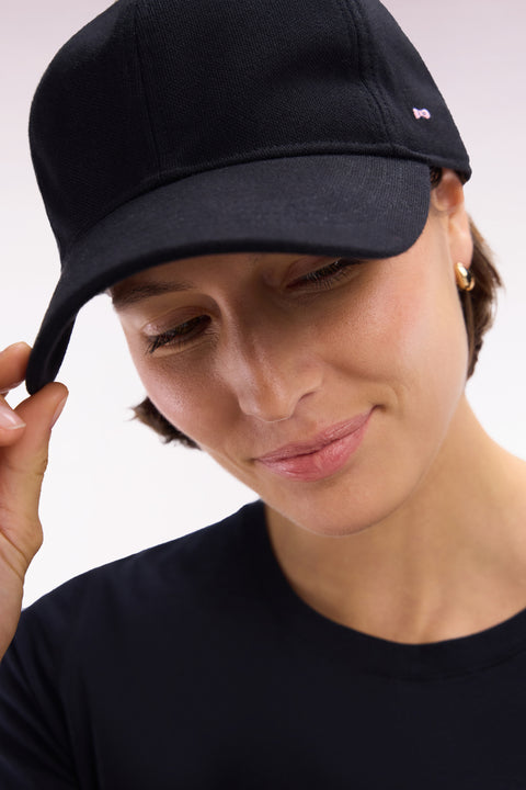 Black cotton piqué cap with bow tie embroidery - Image 1