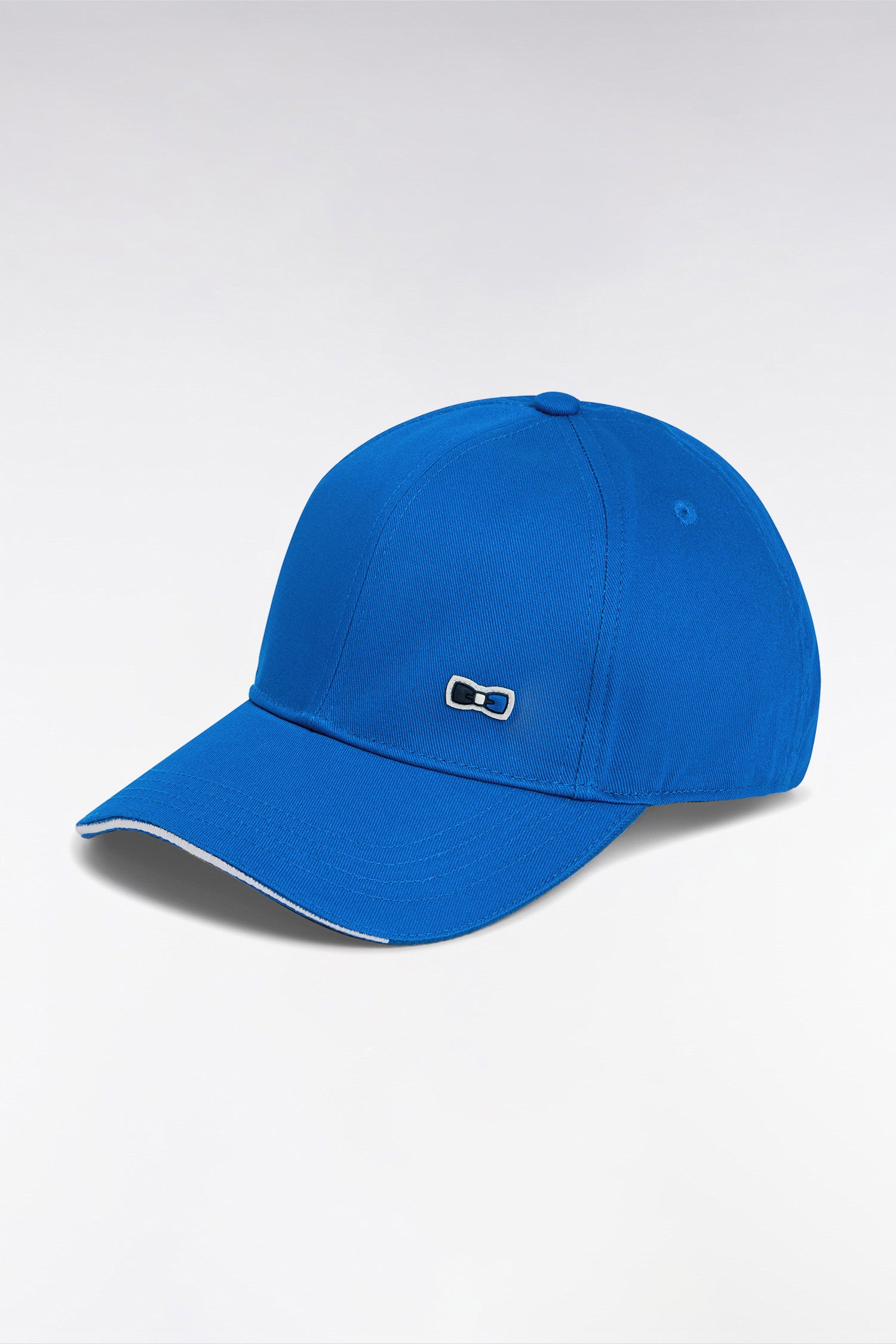 Casquette en twill de coton bleu visière passepoilée