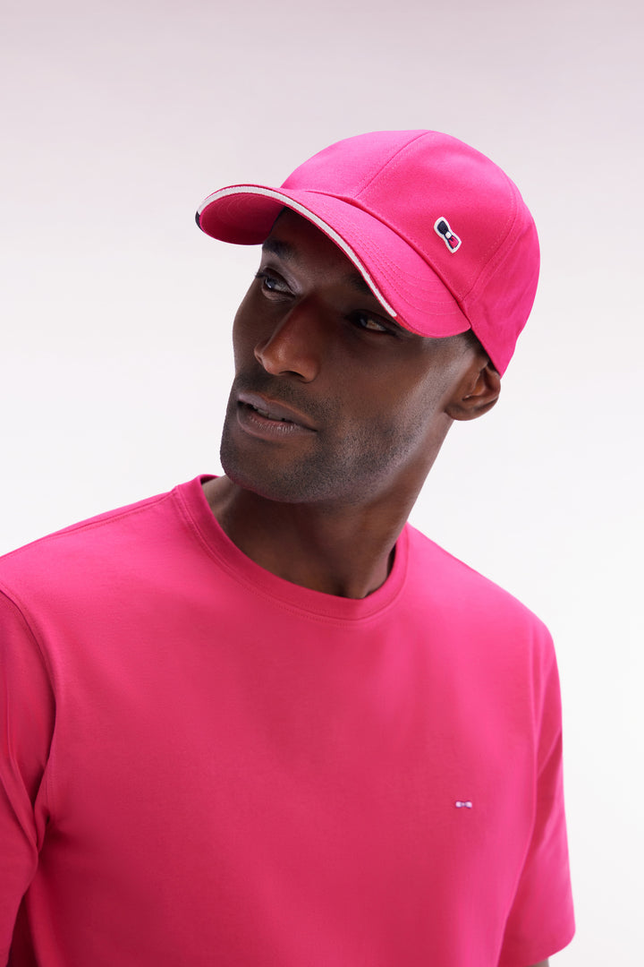 Casquette en twill de coton fuchsia visière passepoilée