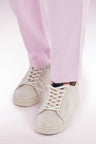 White leather low-top sneakers with pink accents