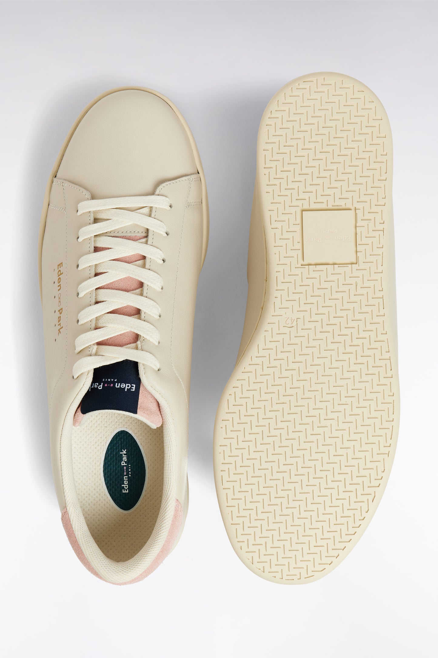 White leather low-top sneakers with pink accents