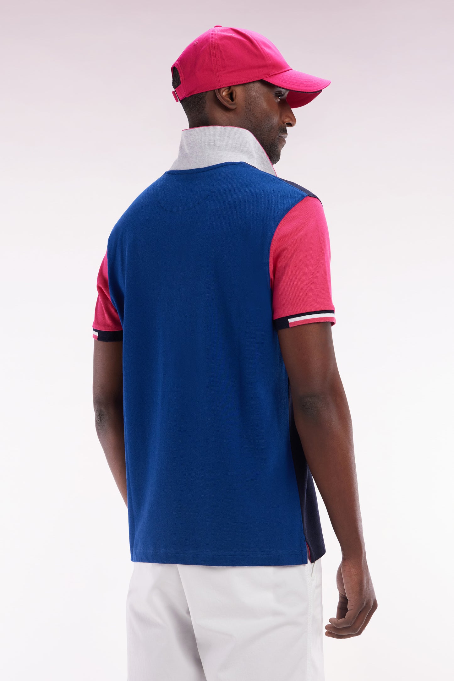 Straight-fit short-sleeved colorblock polo shirt in fuchsia cotton