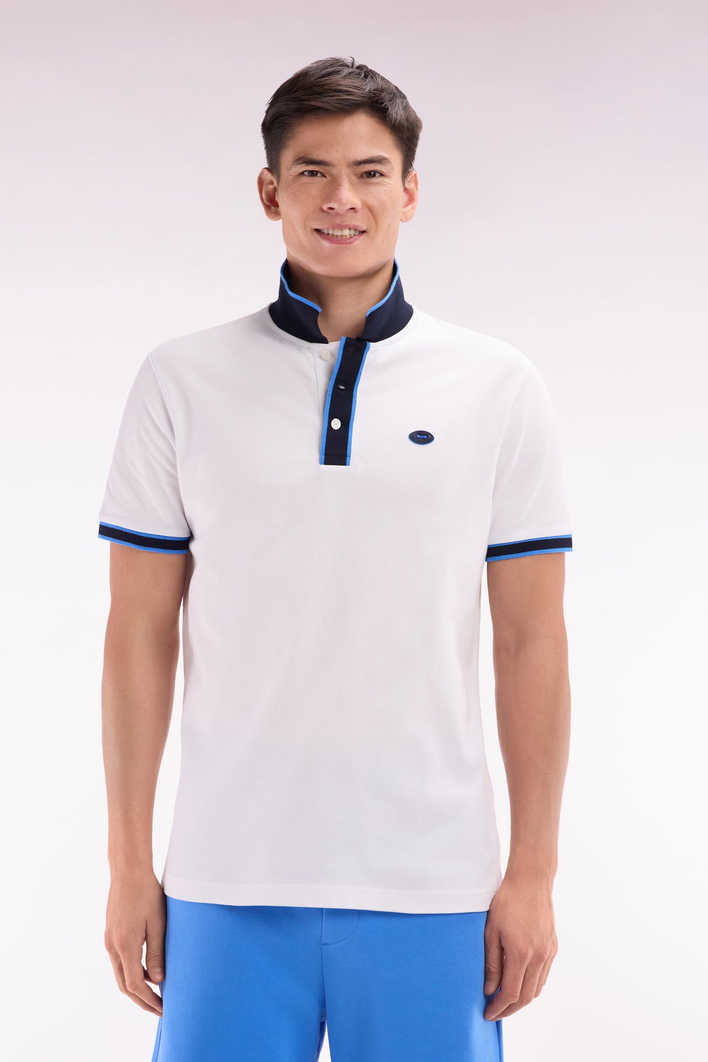 Relaxed-fit short-sleeved polo shirt in blue cotton with colorful stripes