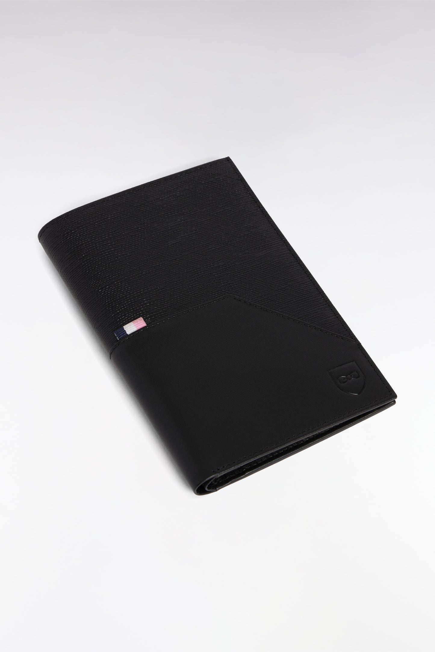 Two-material passport-sized wallet in black leather