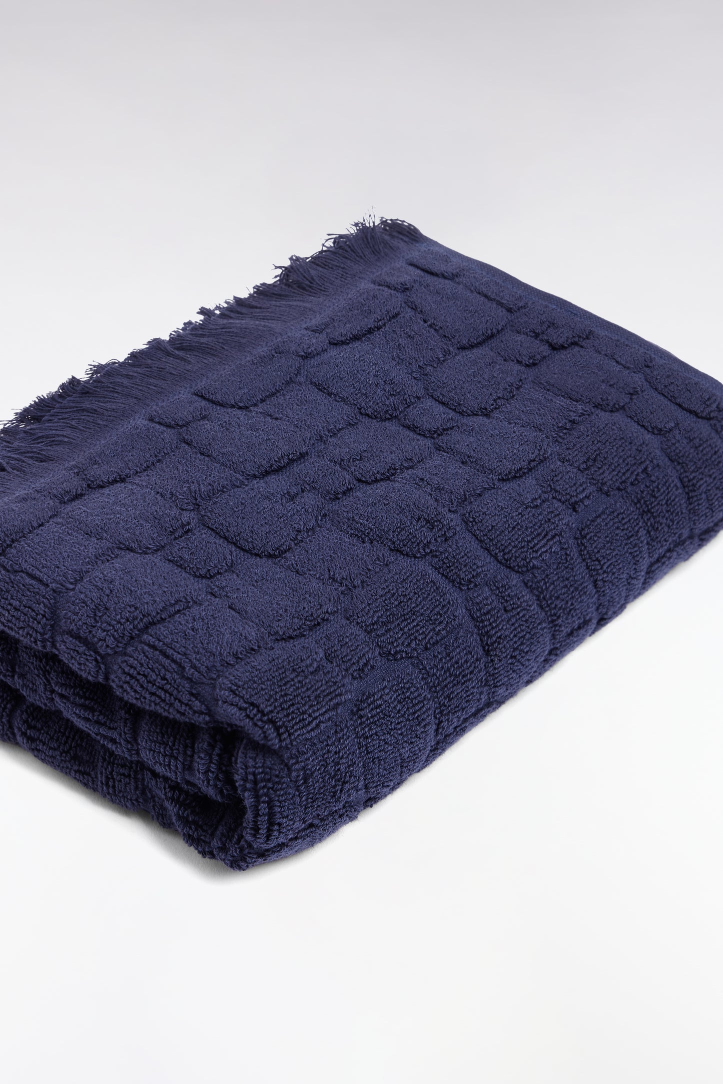 Navy cotton hand towel with bow tie micro-patterns