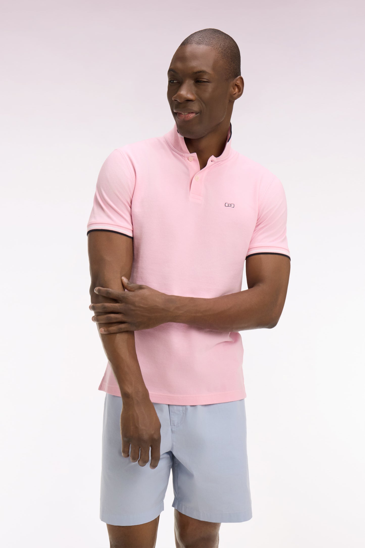Polo à manches courtes en coton rose détails rayés coupe regular