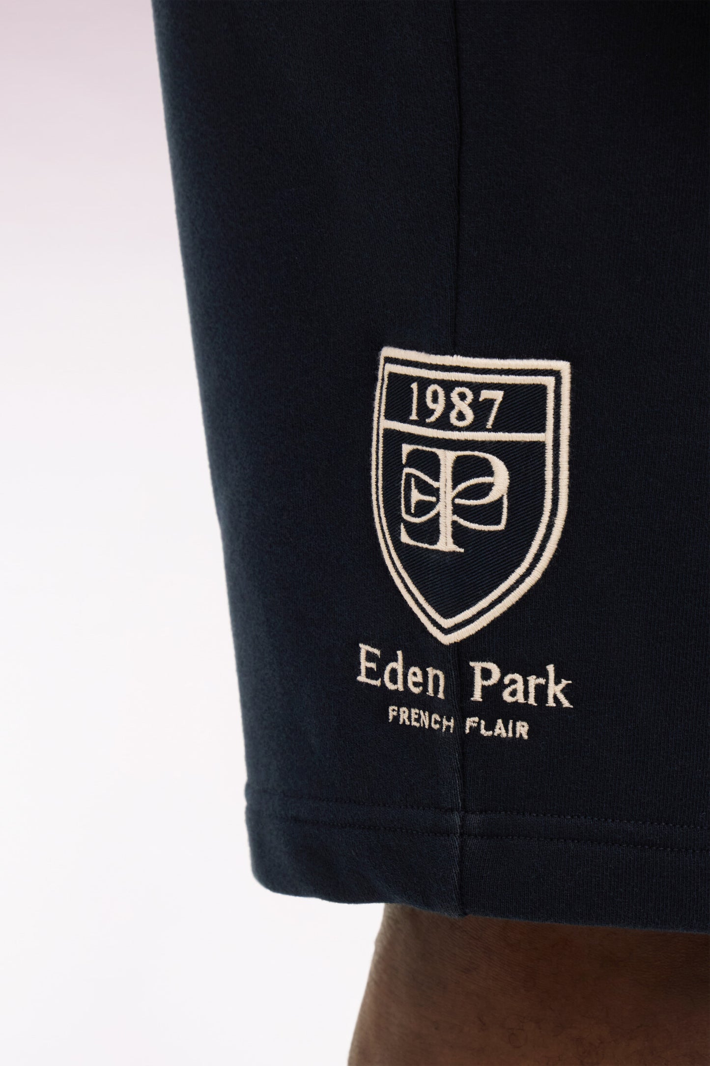 Navy cotton fleece shorts with embroidered badge