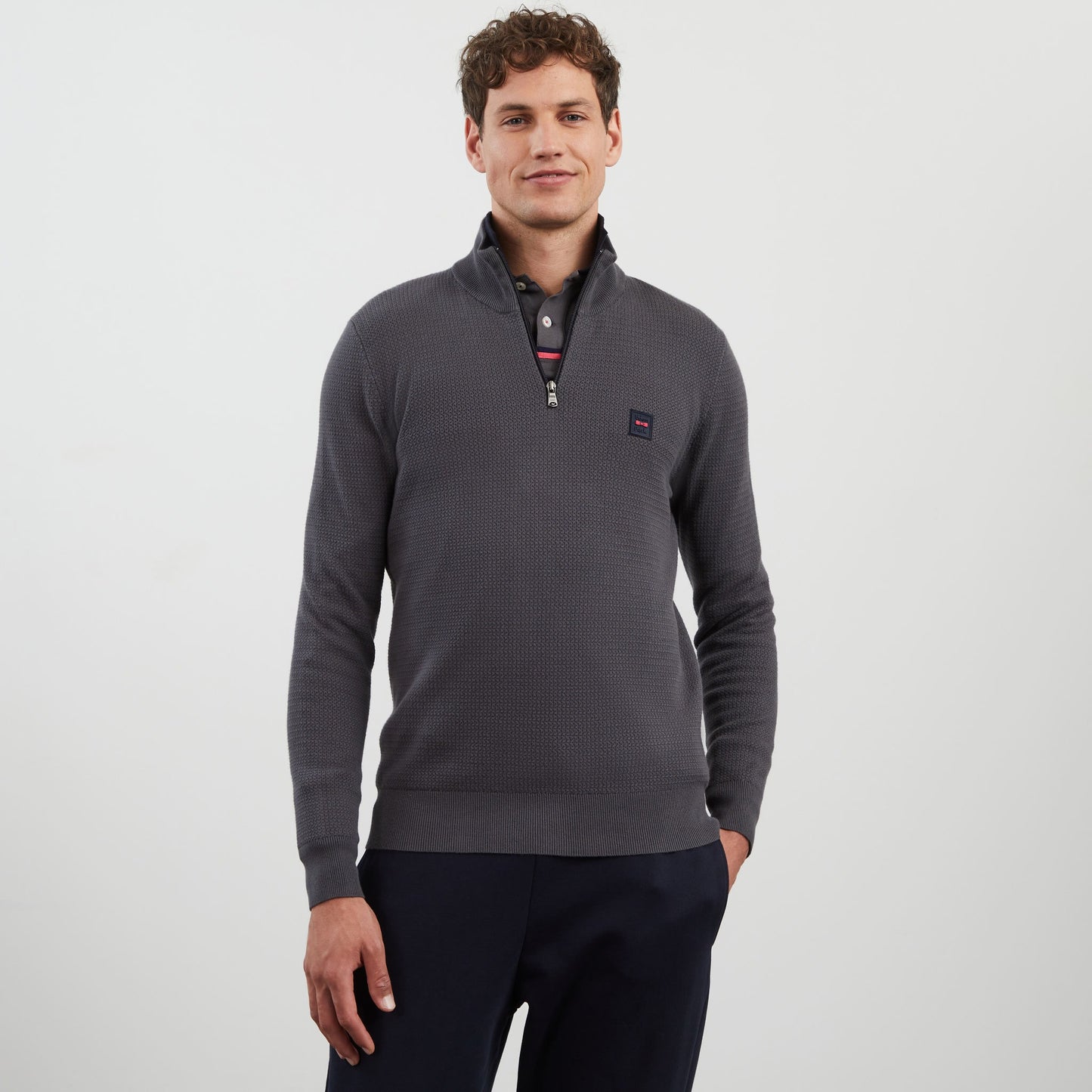 Dark grey zip-neck jumper in decorative cable knit