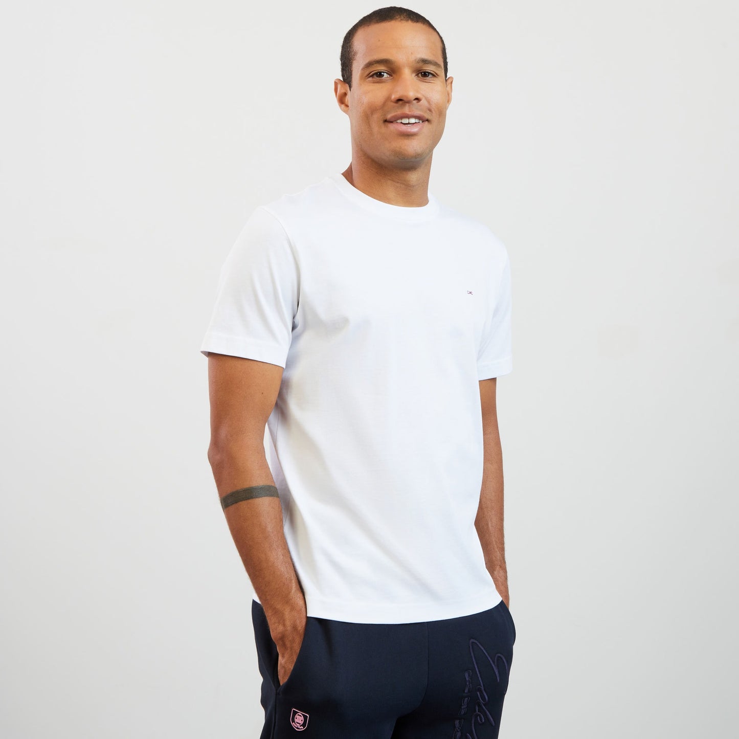 White T-shirt with embroidered bow tie on the back