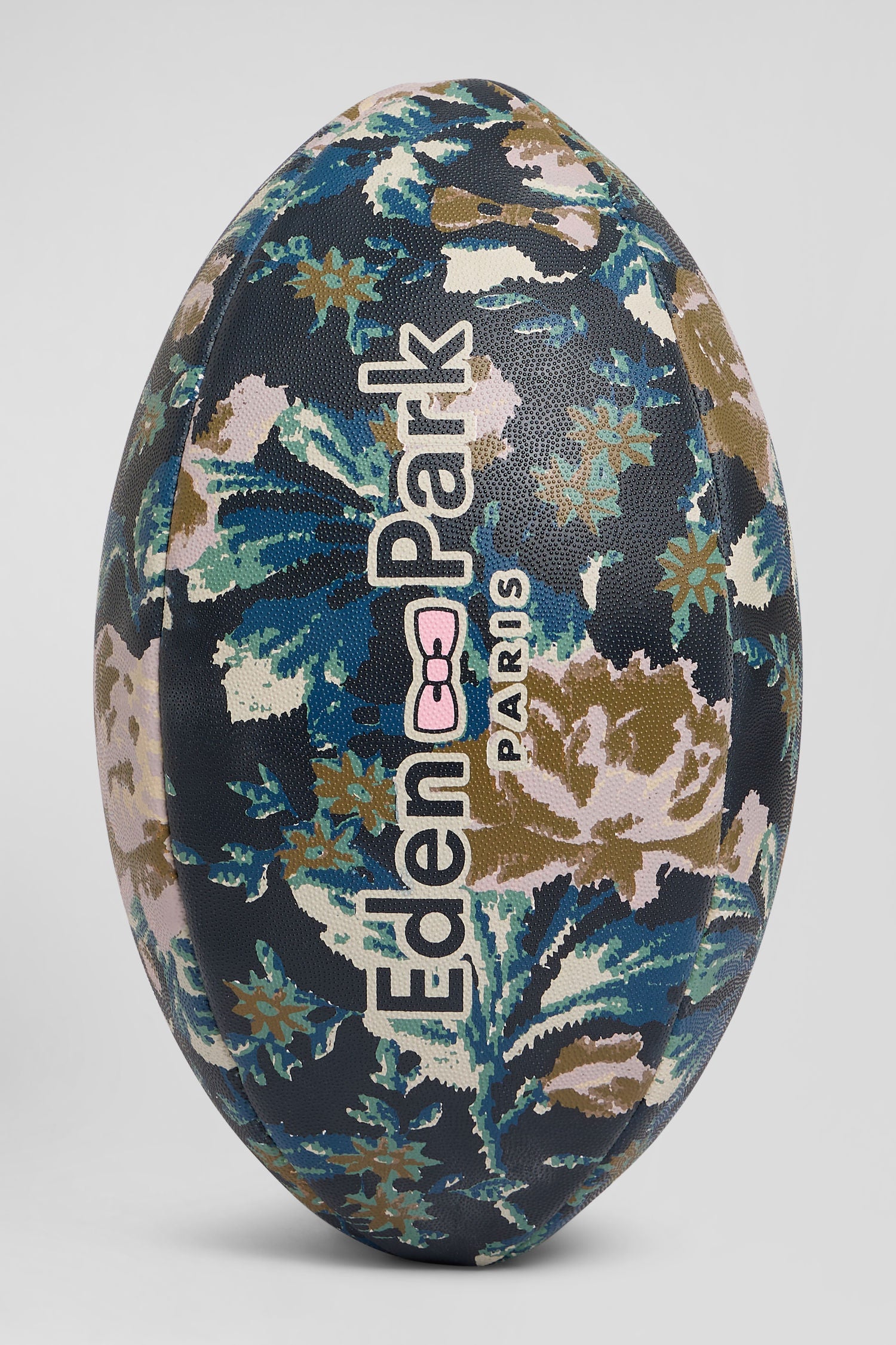 Navy blue rugby ball with floral motifs