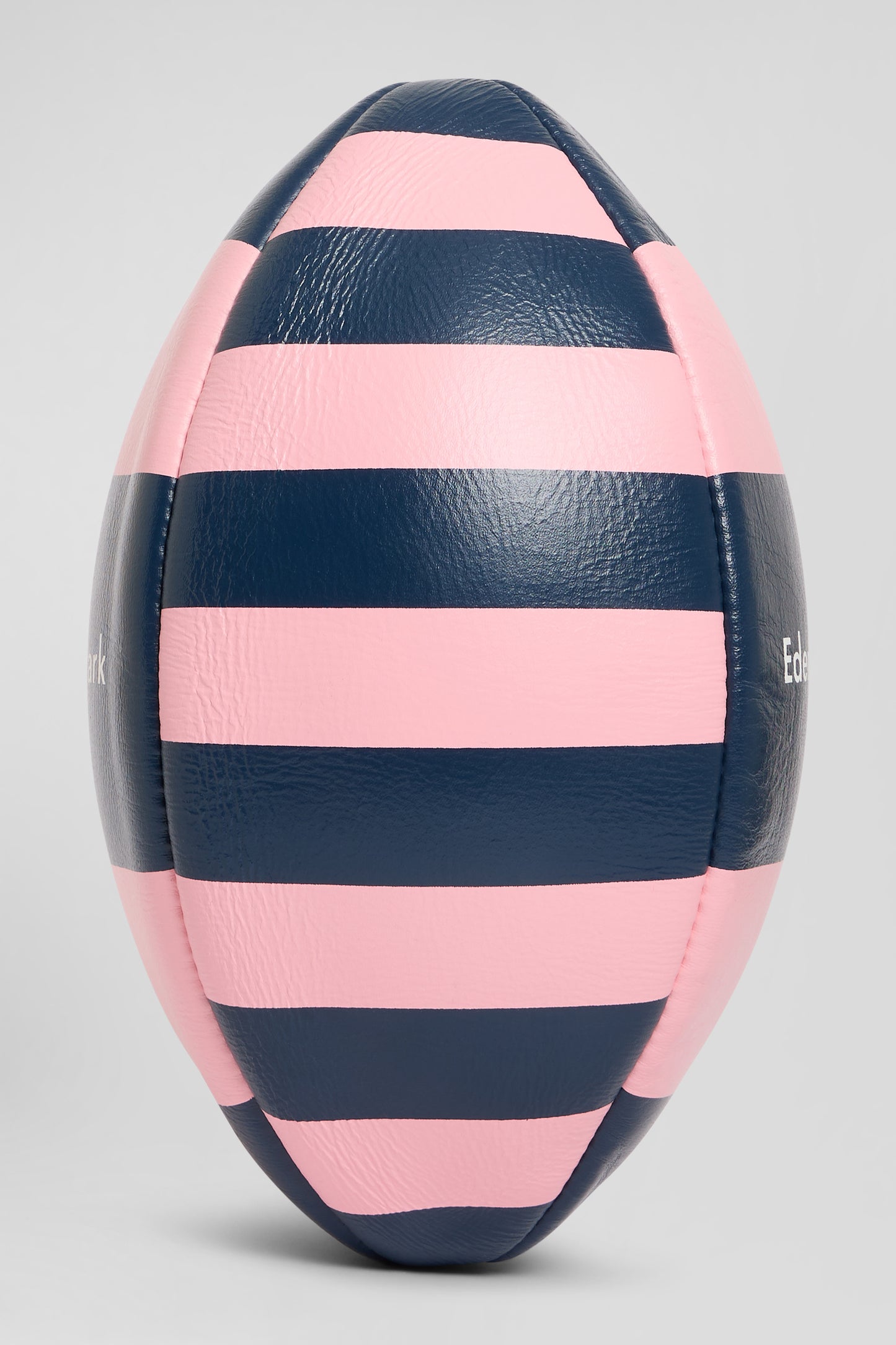 Pink leather rugby ball with striped quarters