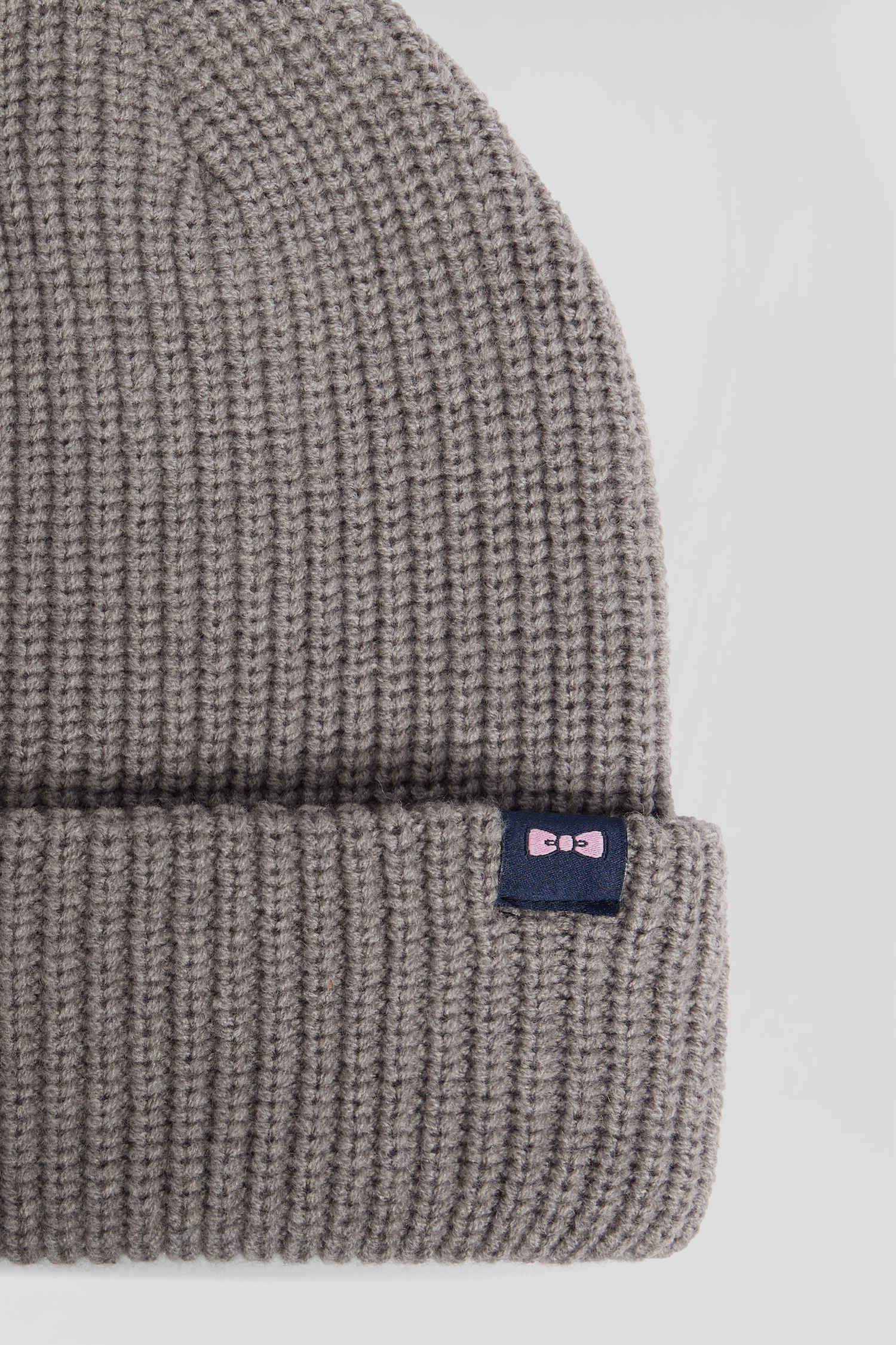 Mottled grey knitted beanie with bow tie embroidery