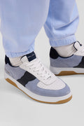 Sky blue low-top leather sneakers with navy blue cut-out