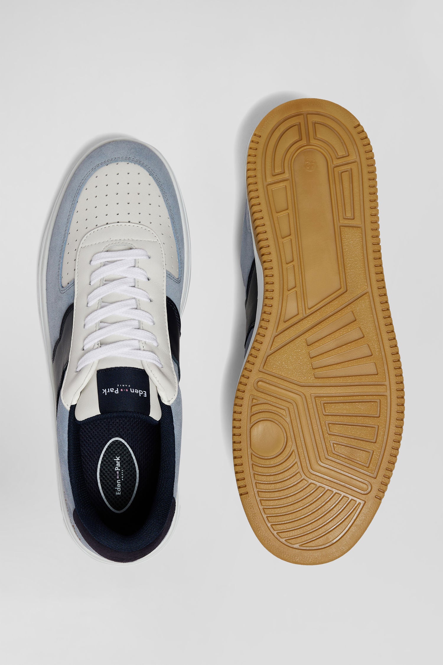 Sky blue low-top leather sneakers with navy blue cut-out