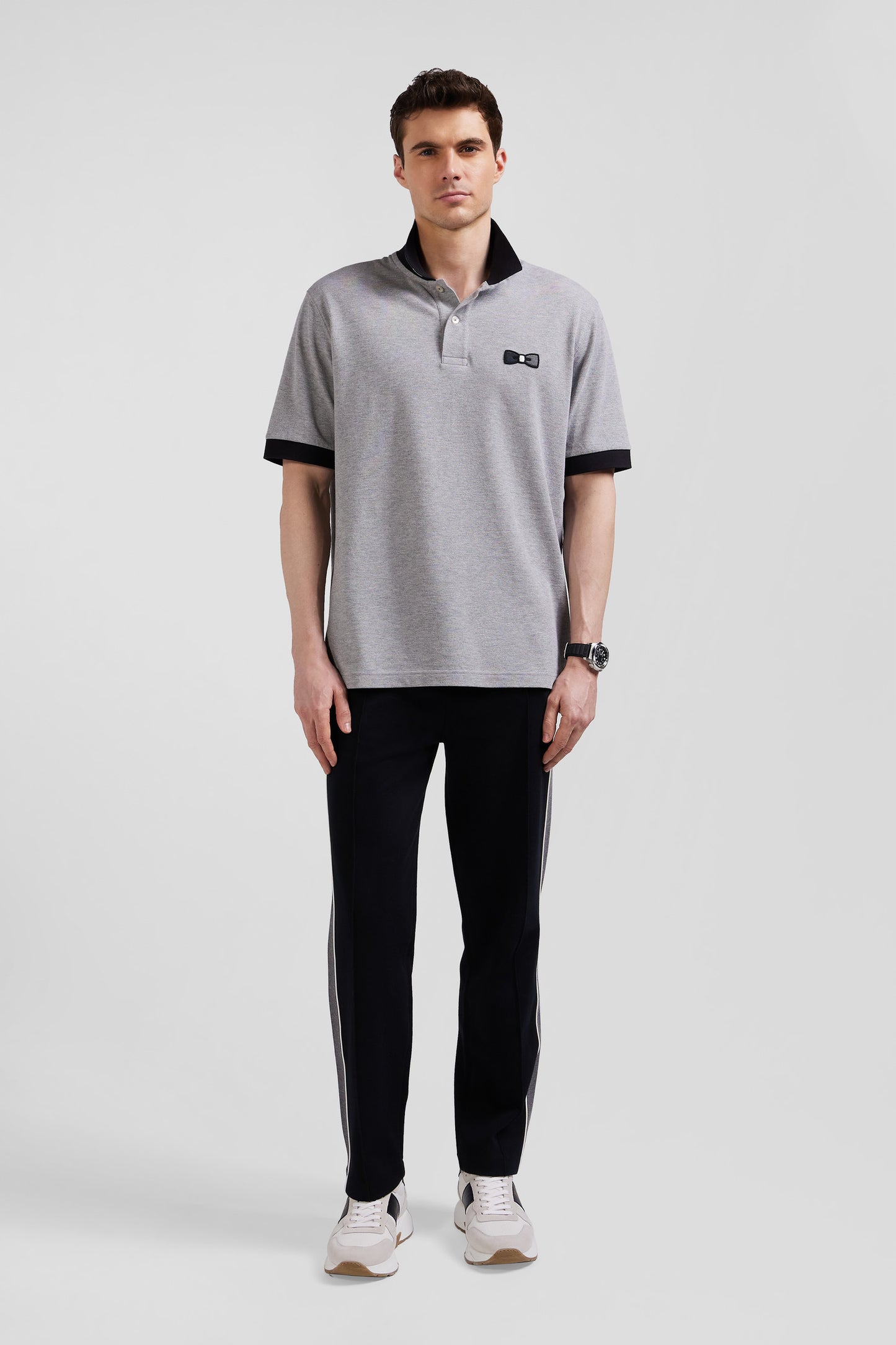 Oversize black short-sleeved cotton piqué polo shirt with tricolor details