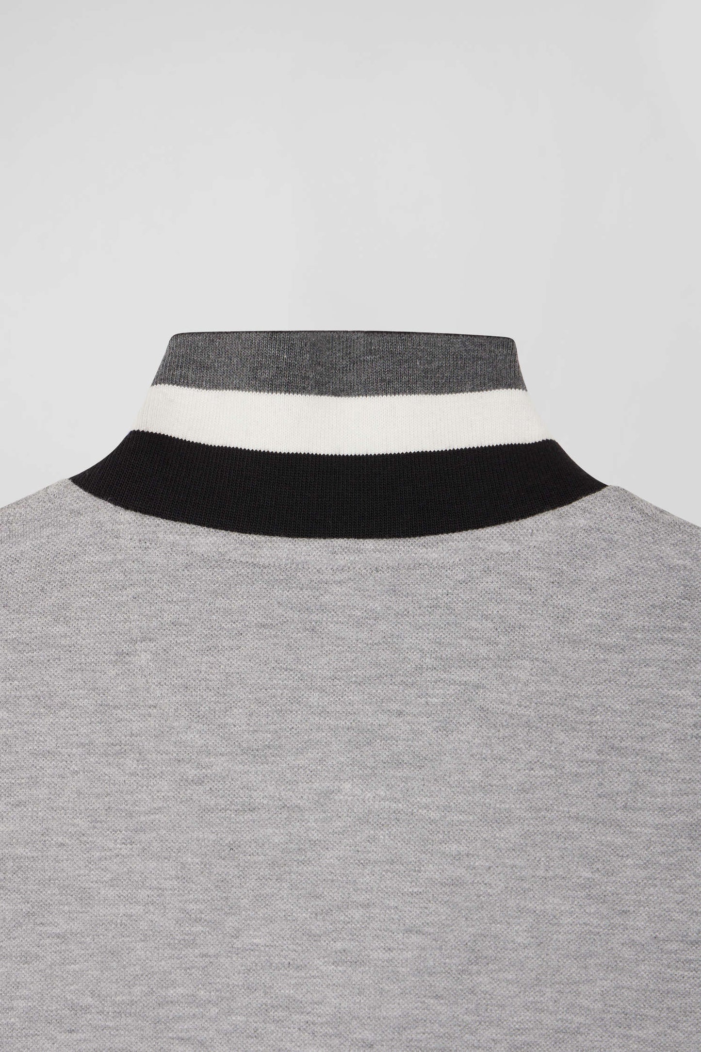 Oversize black short-sleeved cotton piqué polo shirt with tricolor details