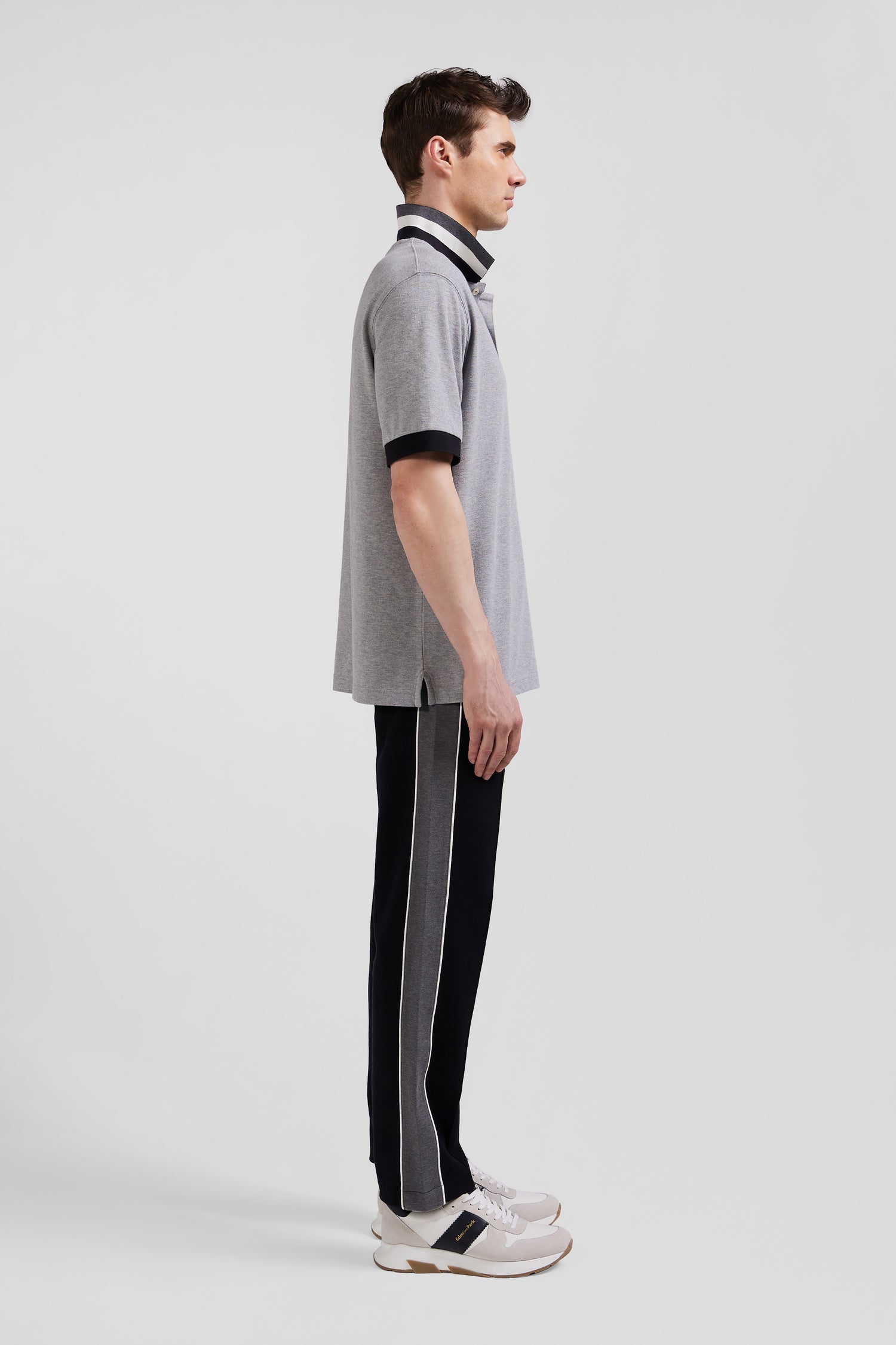 Oversize black short-sleeved cotton piqué polo shirt with tricolor details